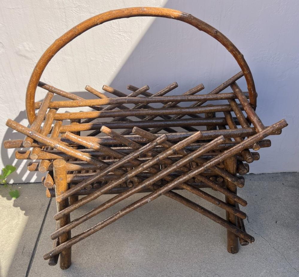 This handmade bentwood indoor or outdoor willow planter is in fine and sturdy condition. It has a all weather protector coat of varnish to protect and make it weather proof. Great addition to any Folk Art or country home collection.