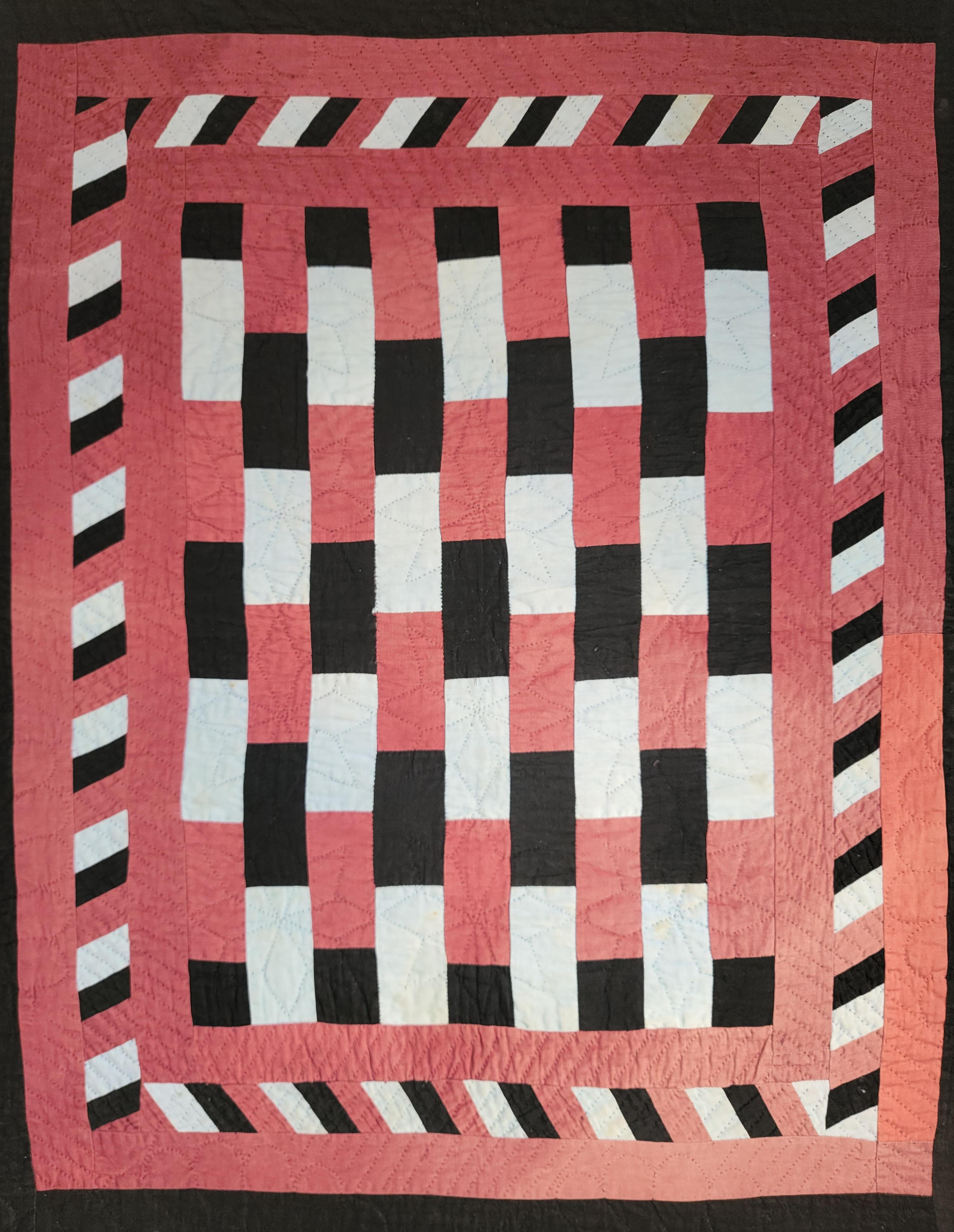 Early 20t century Holmes County, Ohio Amish crib quilt. Ready for hanging horizontal or diagonally.The condition is very good with minor fade in the lower bottom of the quilt.