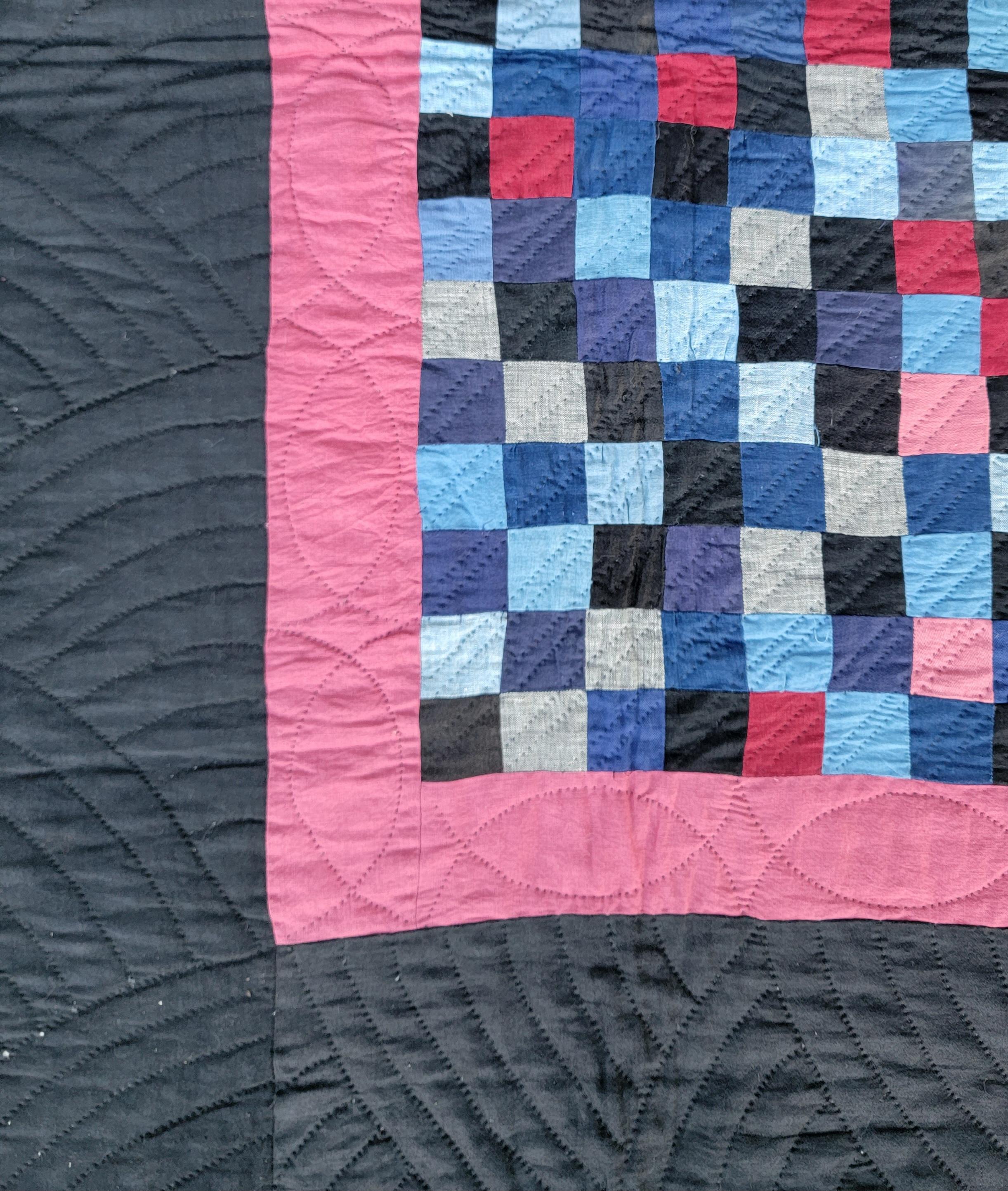 This fine most unusual one patch Ohio Amish crib quilt has vivid colors on a black cotton sateen ground. It comes to us from a fifty year old collection.The condition is pristine and unwashed or used.This is quite a rare crib quilt from Holmes