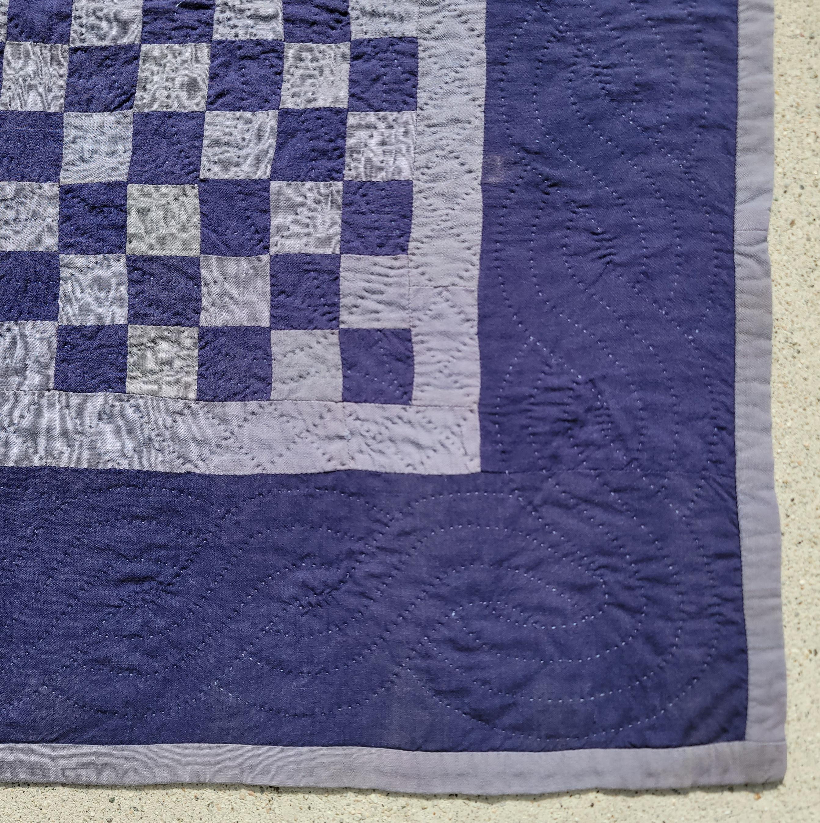 Amish Holmes County,Ohio one patch crib quilt is on a blue ground and light purple blocks.The condition is very good with nice tight stitching & piecework. This comes to us from a private collection in California.
