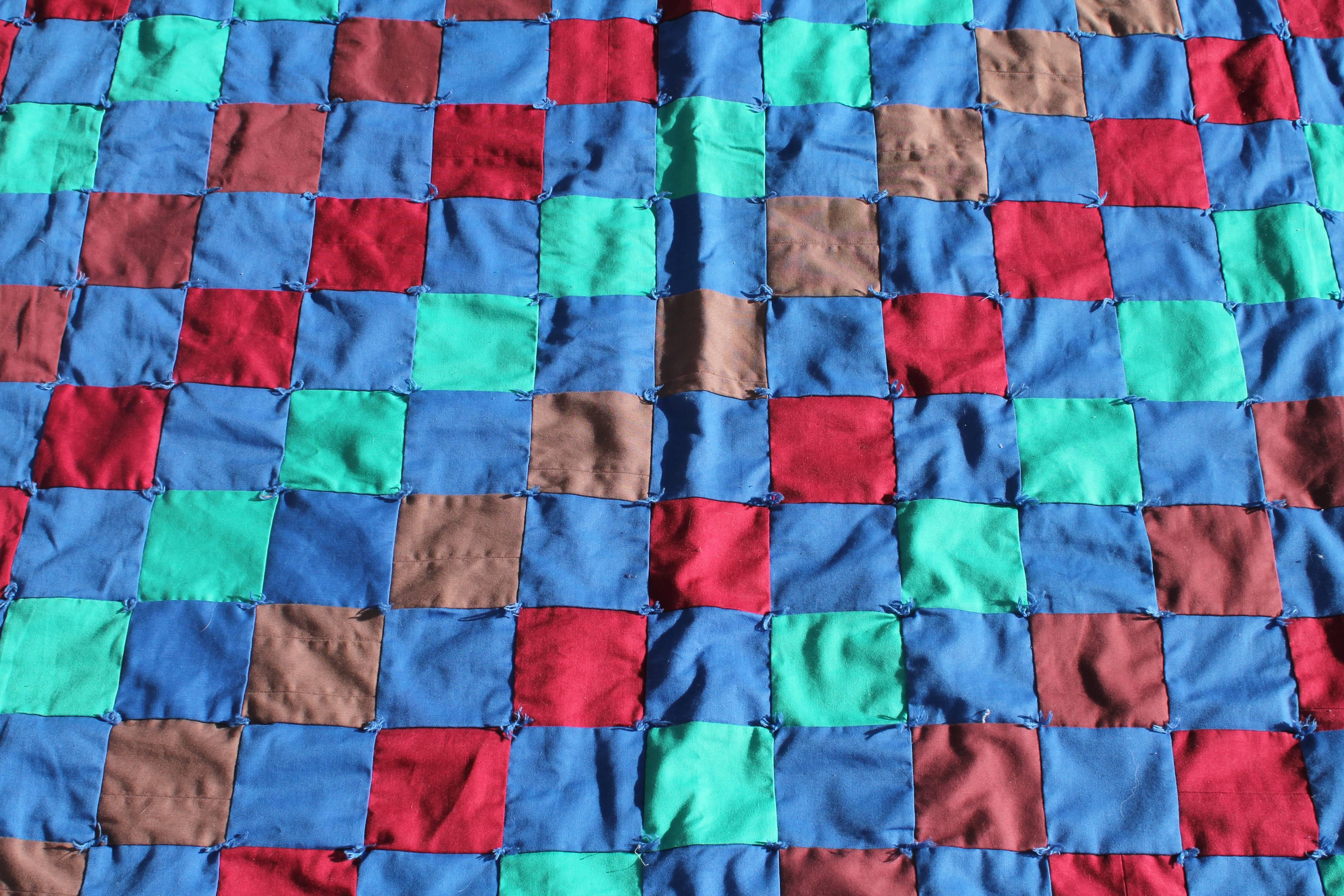 This amazing and colorful one patch quilt is tied and in mint condition. It is very large in size and has the same mint green back as in the front of the quilt.