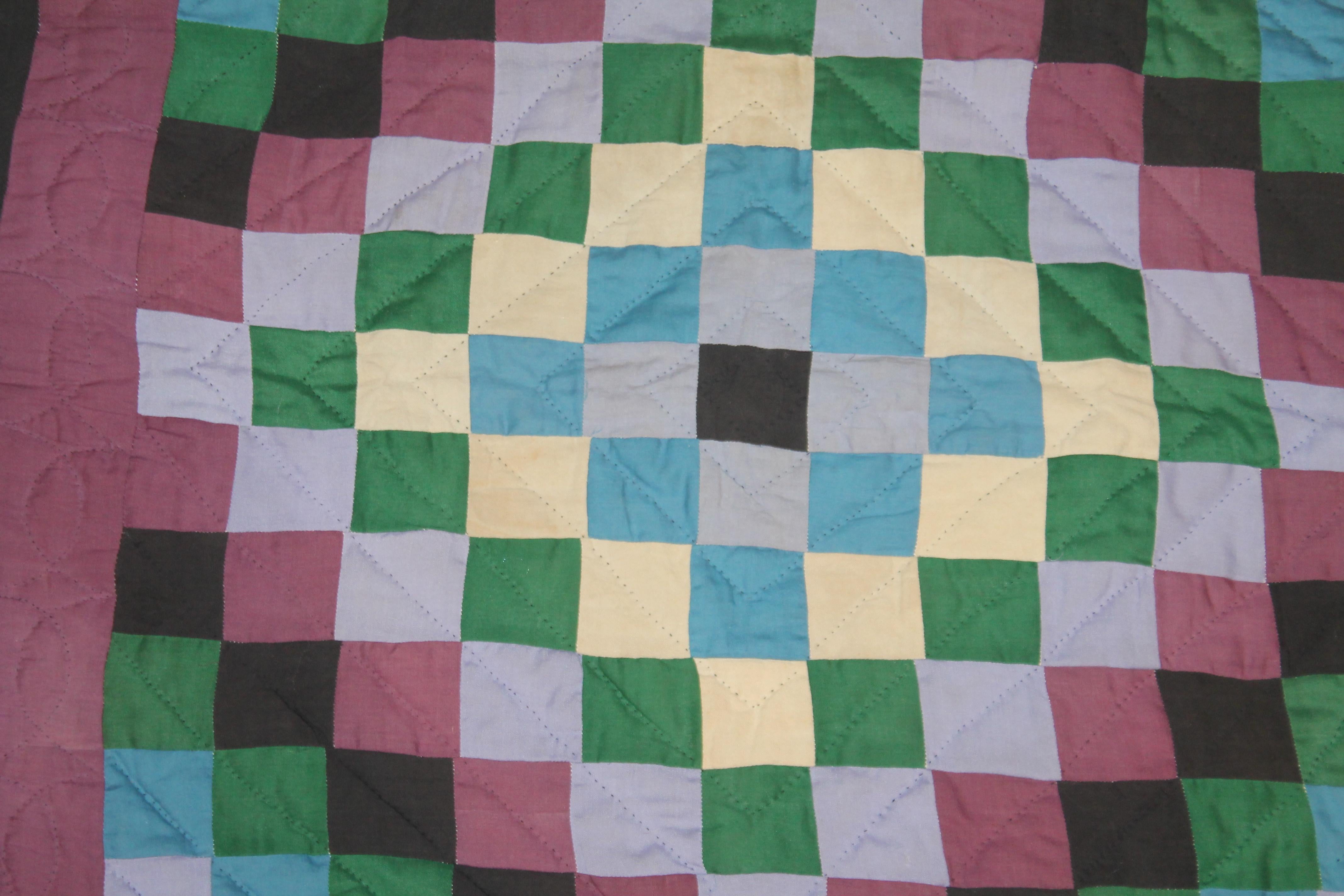 This Amish sunshine and shadow crib quilt is in good condition. It was found in Western Pennsylvania.