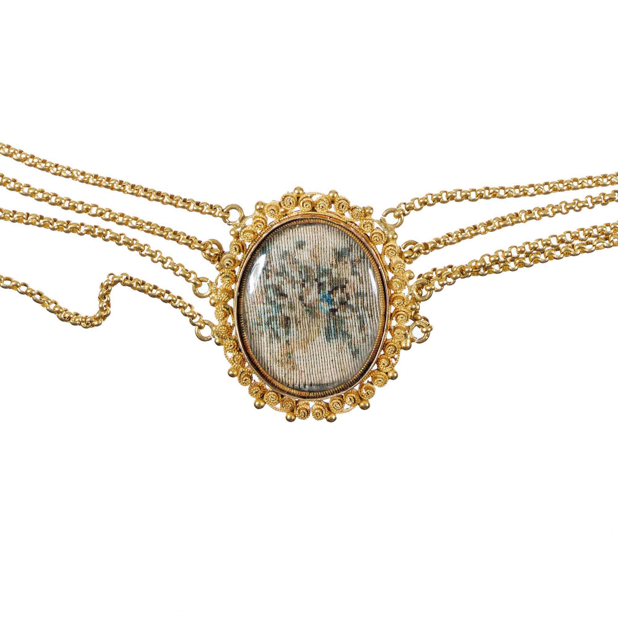 Victorian handmade French 18k gold necklace with 7 handmade needlepoint flower sections in hand made gold frames.  4 strands of chain connect each section. The catch has enamel trim and is lettered Amitie (for Friendship).  Circa 1880's.  A crystal