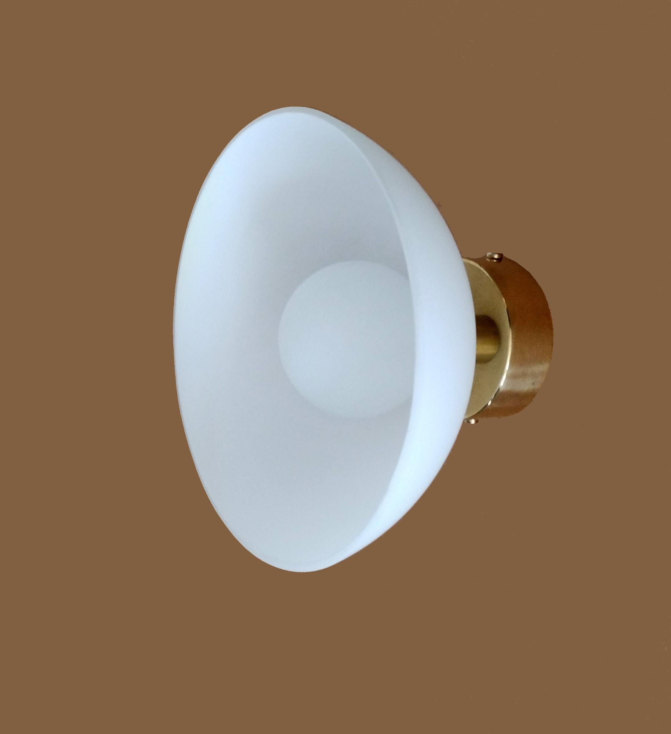 AMIZ is made of brass and opal matte shade. Light emits from the central opal matte sphere.
Shade is non adjustable.

Finished and assembled by hand.

Measures: D 19 cm / W 12 cm. 

Lamping: integrated LED bulb G9

This piece is hardwired. Plug-in