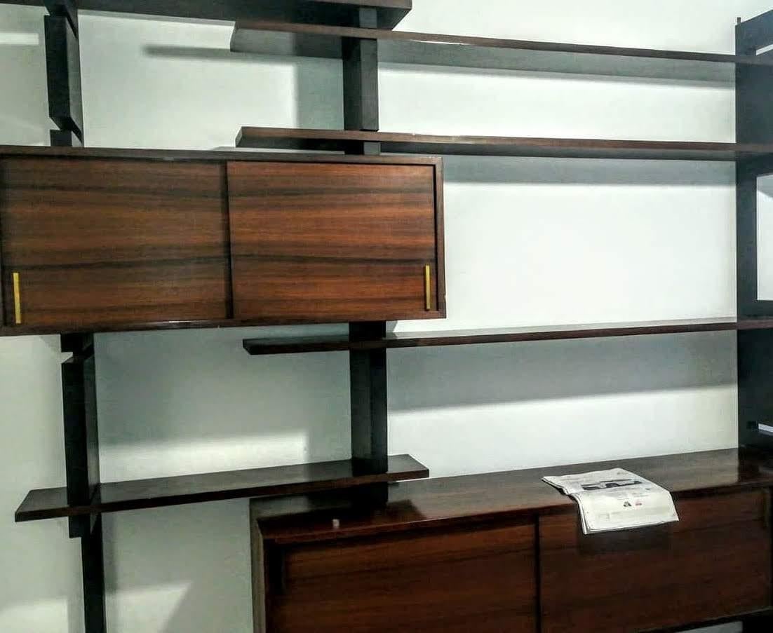 Amma bookcase Mid-Century Modern Production by Amma Form Torino Italy in the 1960s. Composed of interchangeable elements.
Black lacquered wood uprights. And brown wood shelves and containers in veenered wood. Laquared wood, brass-plated.
Good