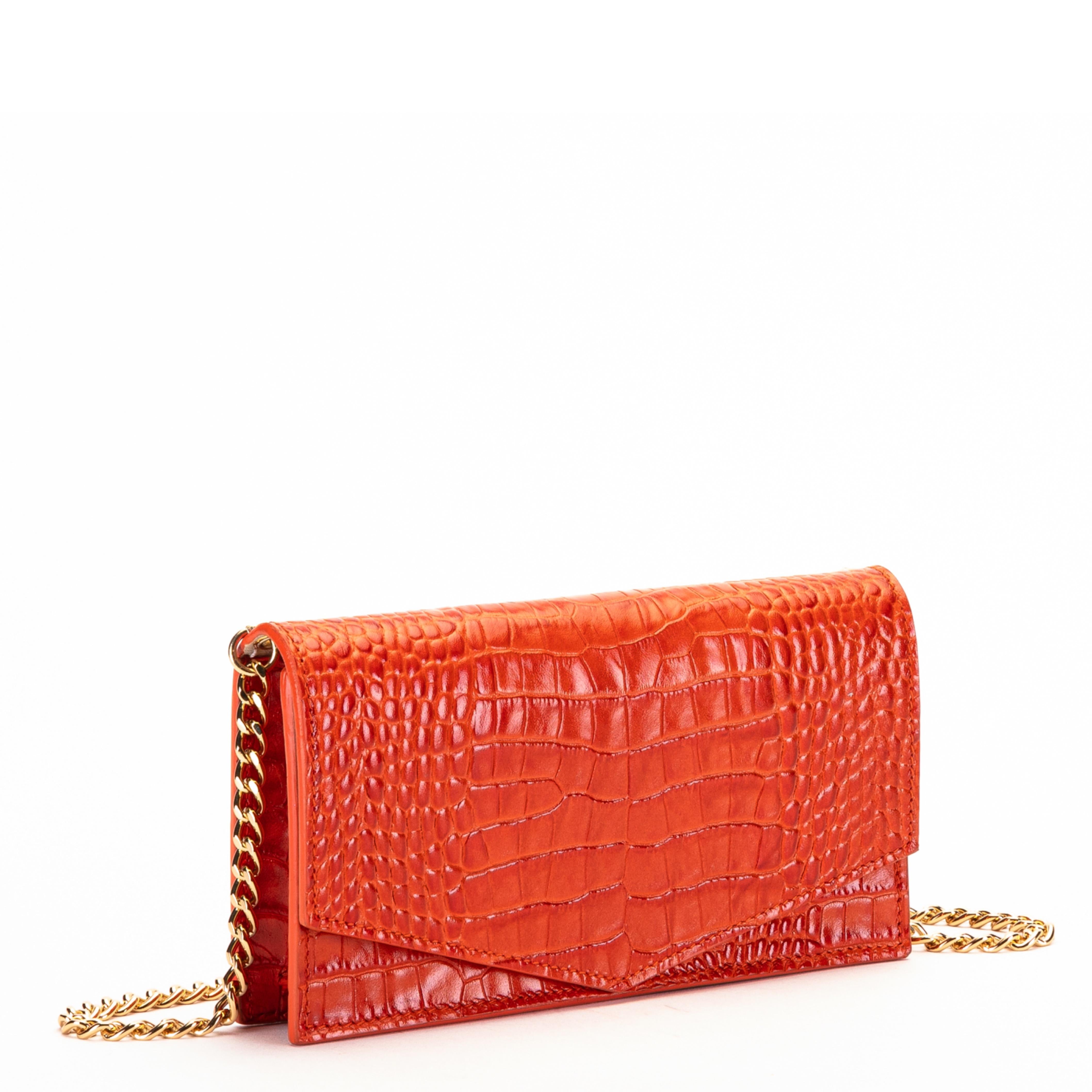 Amma Mode Ianira orange croco printed leather shoulder hand bag
A mini-bag coming straight out of a fairy tale! With its linear design, enhanced by the elegant golden shoulder strap, the IANIRA mini bag is entirely handmade in crocodile-printed