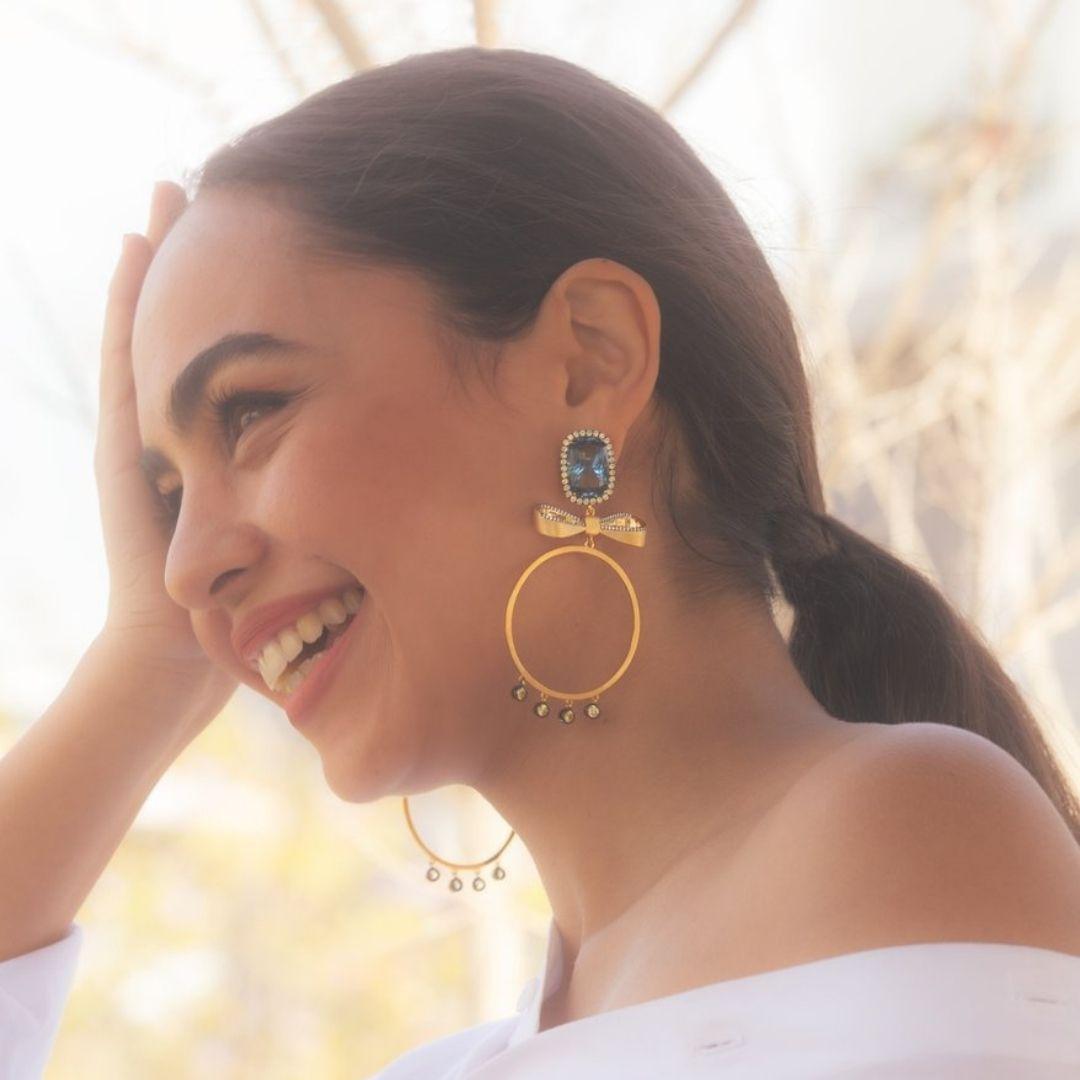 The Blue Spinel Hoop earrings are fiercely feminine. They are masterfully handcrafted from vermeil gold, sterling silver base with 18k yellow gold plating. With our signature satin finish, high grade Blue Spinel and hand set zircon and Citrine.