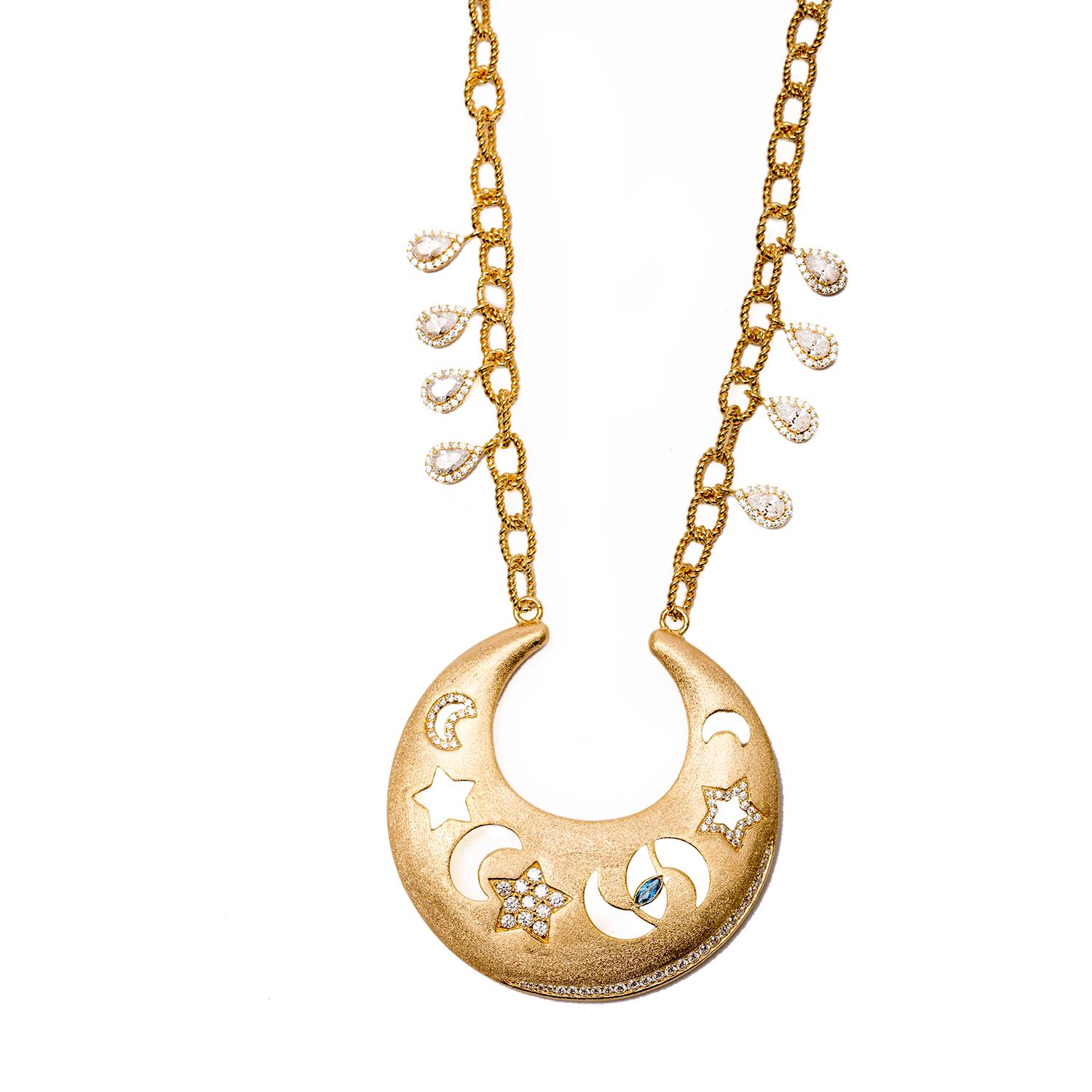A gorgeous take on the sky, Sa'mma, the universal blanket the covers mankind and connects us all. Hand carved necklace with moons, stars and a protective eye that watches over us all. Sterling silver base with 18k gold plating, vermeil gold, with