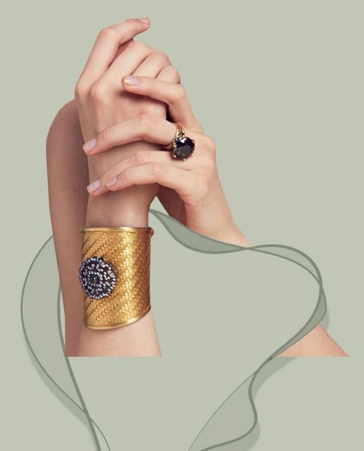 A statement like no other from our Sa'mma Collection. Inspired by the sky- the universal blanket that covers mankind and connects us under its wings. Perfectly handwoven cuff; 18k gold plating sterling silver- Vermeil gold. Center motif 925 sterling