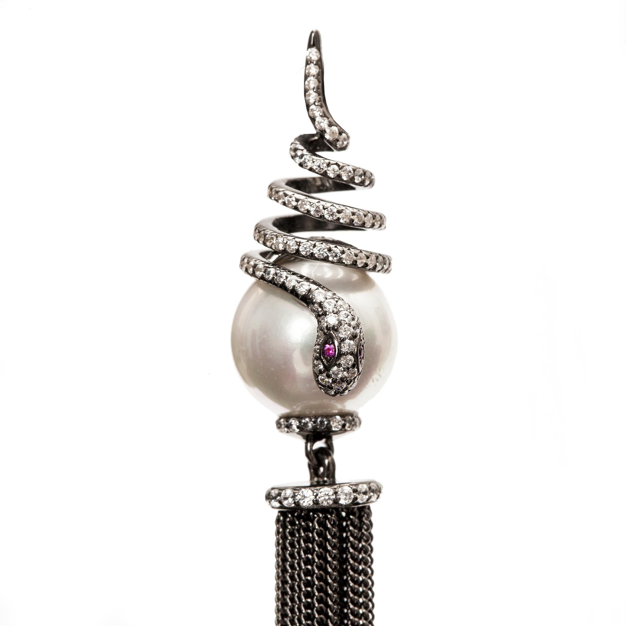 Sahara earrings are part of AMMANII's Princess Collection. It embodies the femininity and allure of a woman- The Princess. Hand crafted from sterling silver with black rhodium plating, fresh water pearls and hand set zircon.  
