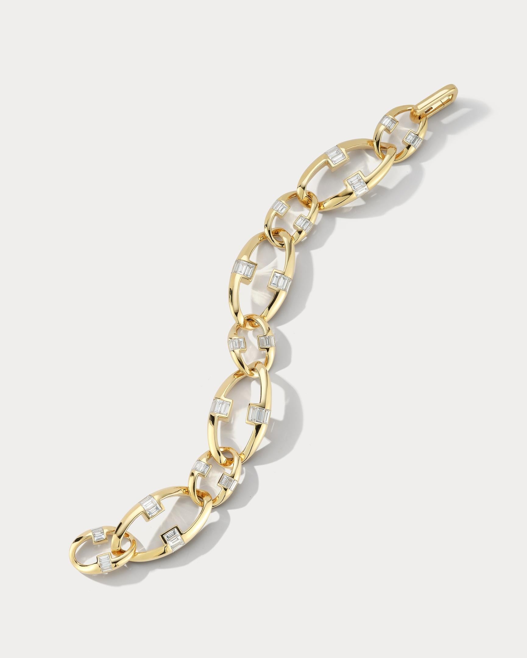 Elevate your style with this stunning 18k link bracelet, set with glittering baguette diamonds totaling 3.97 carats. The diamonds are expertly set in the links, creating a brilliant and eye-catching sparkle with every movement. The signature lock