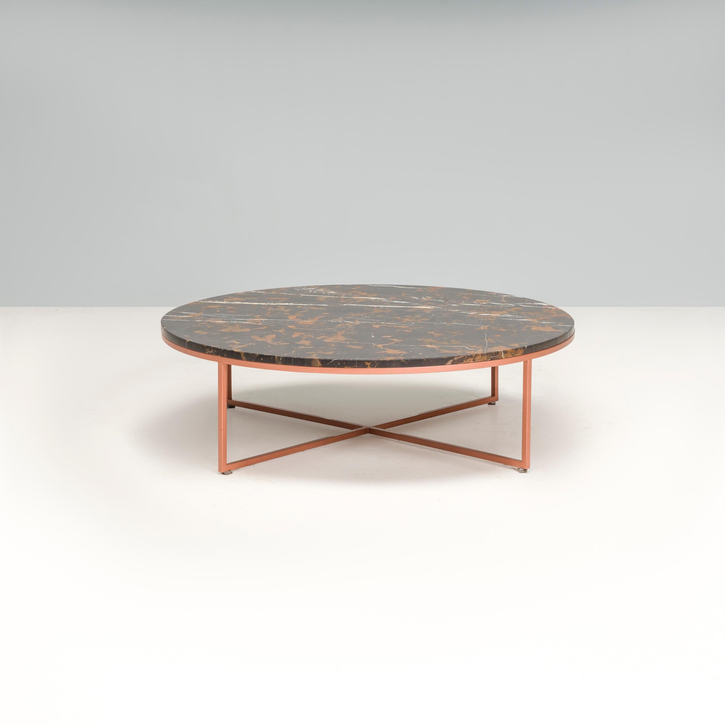 Designed and manufactured by Amode, this Porto coffee is a luxurious piece of contemporary design. Featuring a stunning gold black marble tabletop, the circular coffee table allows the material to take centre stage.

Sitting on a slimline metal base