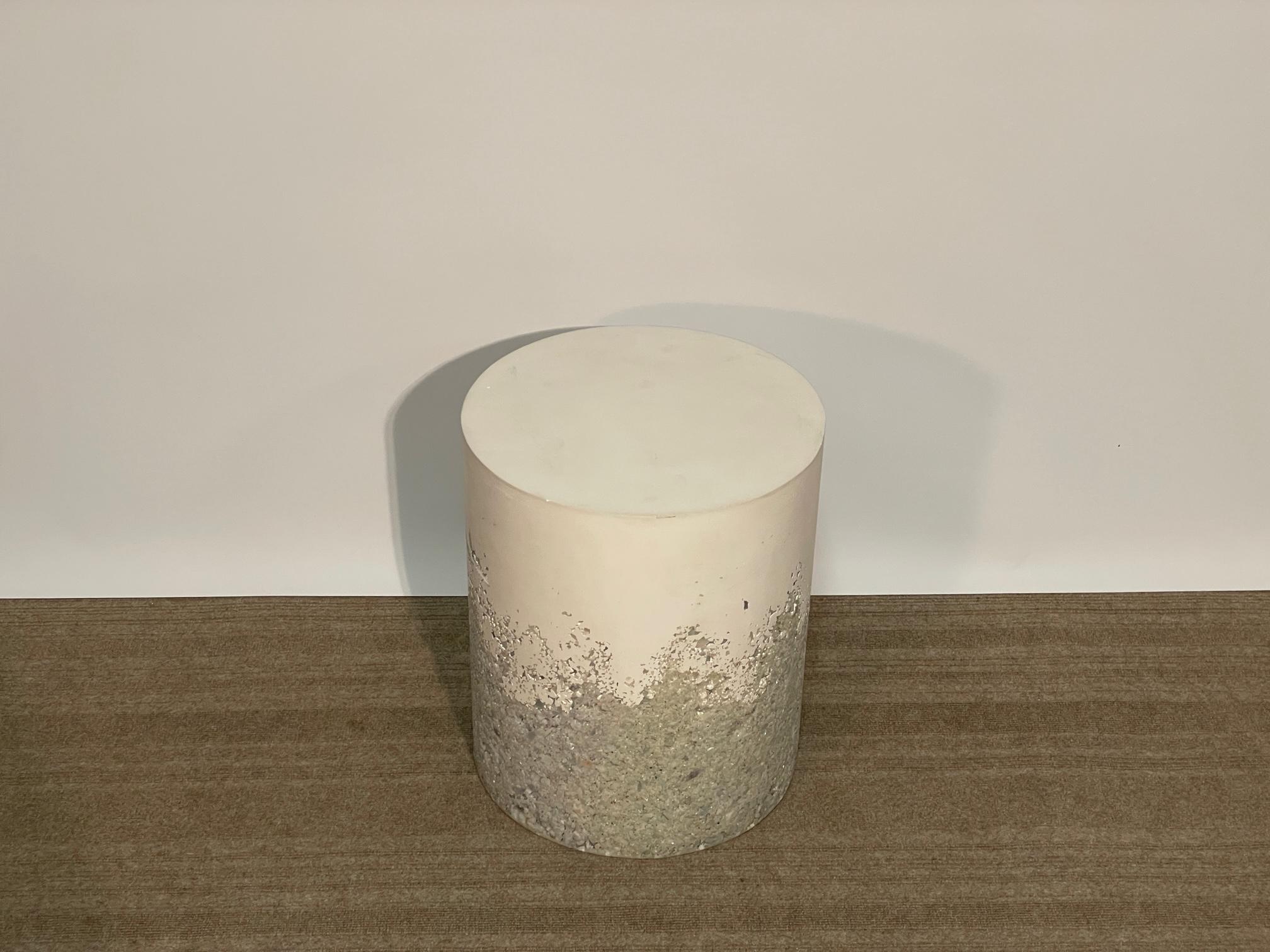 The Drum by Amoia Studios is a study in fusion between the delicate Clear Calcite from India merged with Plaster finished Cement.  The millions of different facets created by the Calcite blends into a smooth cylinder up top.  Useful as either a side