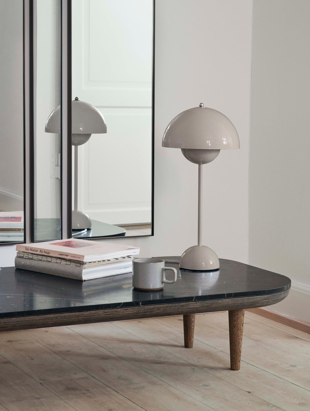 First designed for the SAS Royal Hotel in Copenhagen by Space Copenhagen, this geometric mirror comes as a rectangular full-length. 
It is produced to the highest standard in Italy, with a bronzed brass frame and a silver-colored mirror.
The mirror