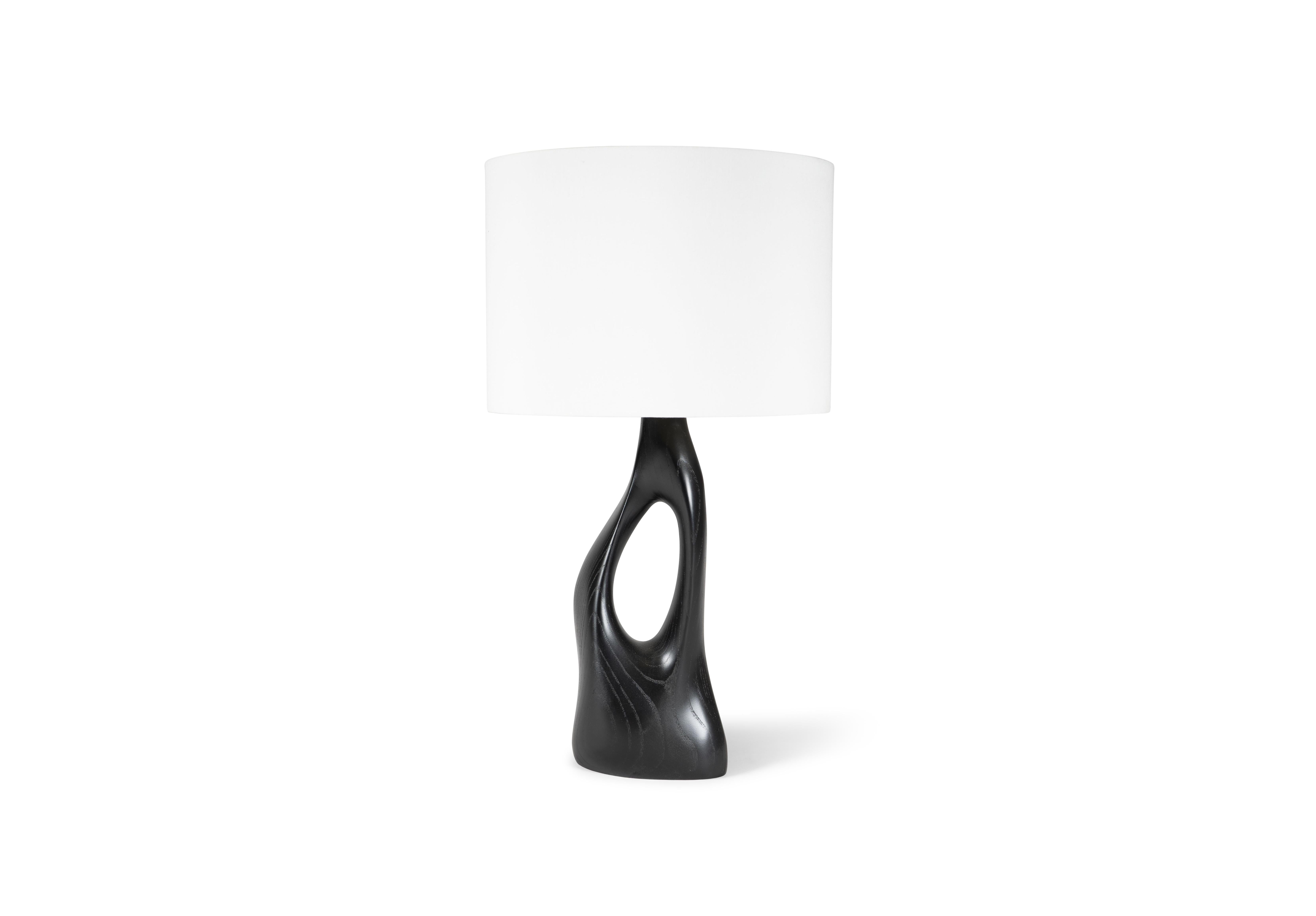 The Helix table lamp offers a unique and modern look for luxury homes. With its contemporary design, this table lamp is sure to add a touch of elegance to any space. Available with either a round or oval shade, you can choose the option that best