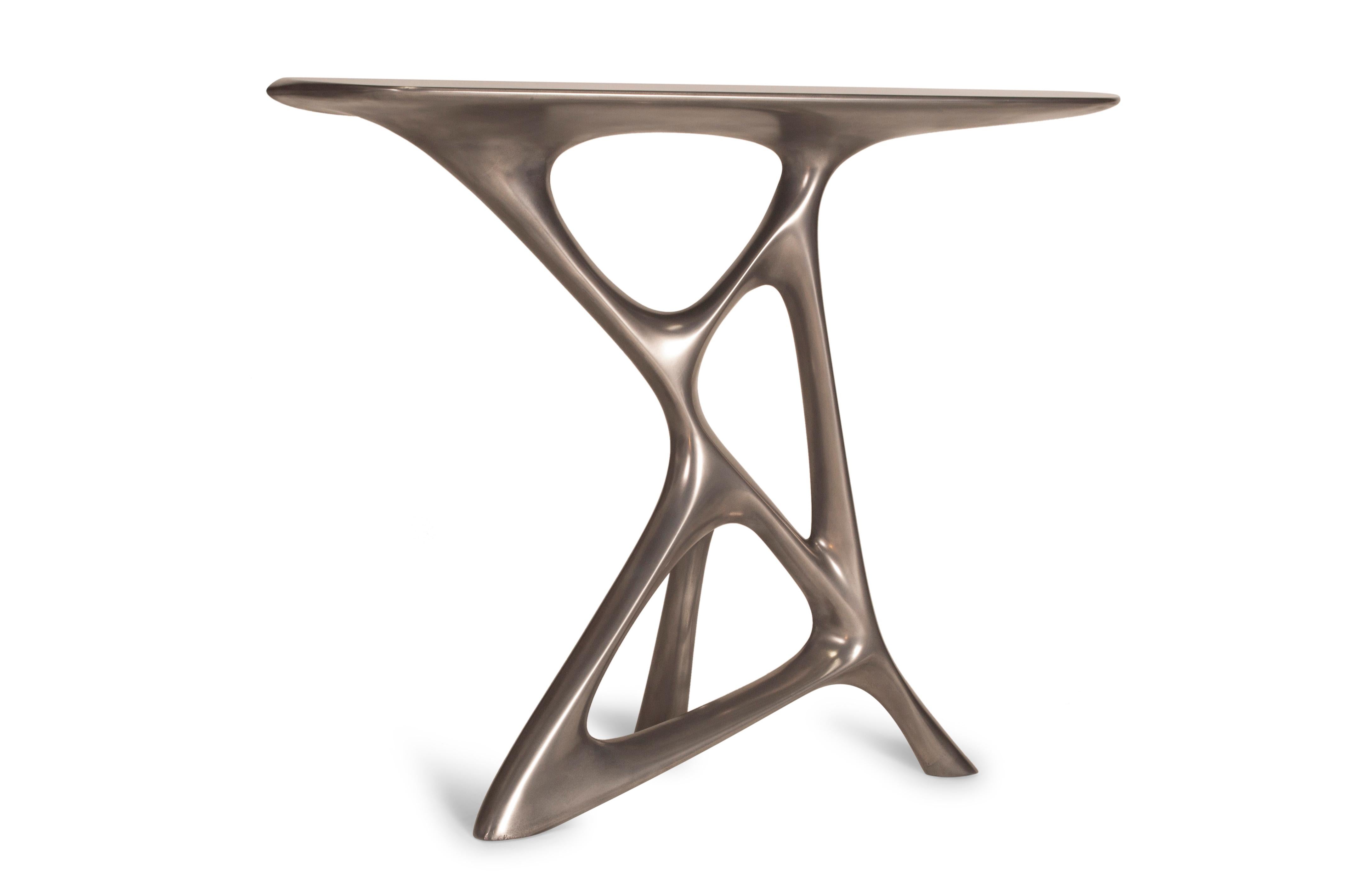 Amorph Anika console, stainless steel finish.

About Amorph: 
Amorph is a design and manufacturing company based in Los Angeles, California. We take pride in hand crafted designs connected to technology to create sophisticated, design driven