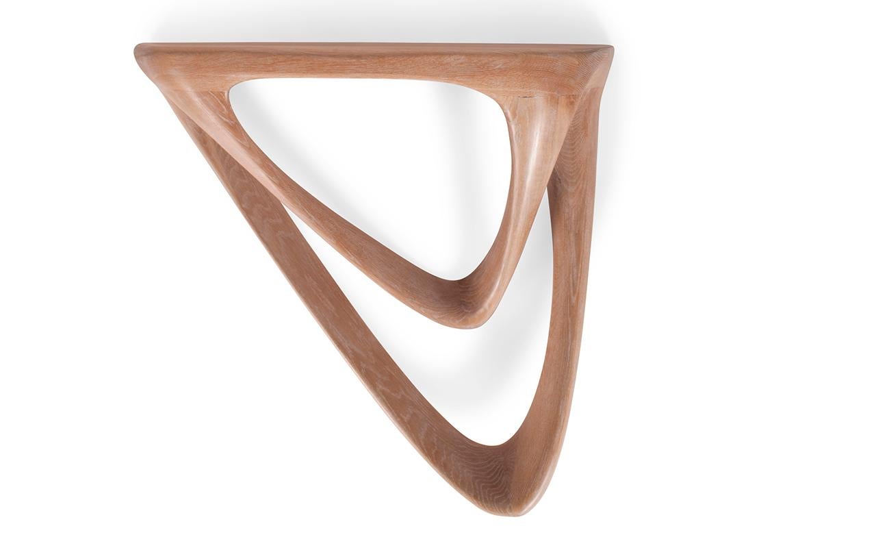 The Aras console table is a truly unique and stylish addition to any modern contemporary home. This wall-mounted console table features a hanging concealed bracket, giving it a sleek and minimalist look. The Aras console table can be customized to