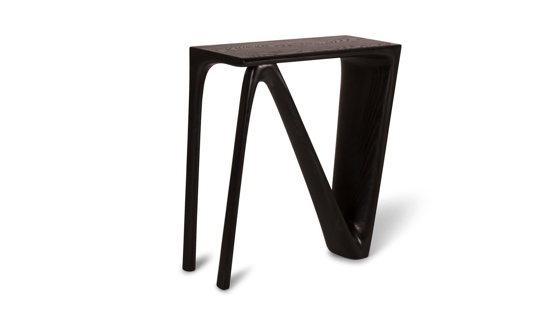 The Astra console table is a sleek and modern piece of furniture designed specifically for contemporary homes. It features a minimalistic design and can be customized in terms of finishes and sizes to suit individual preferences and the overall