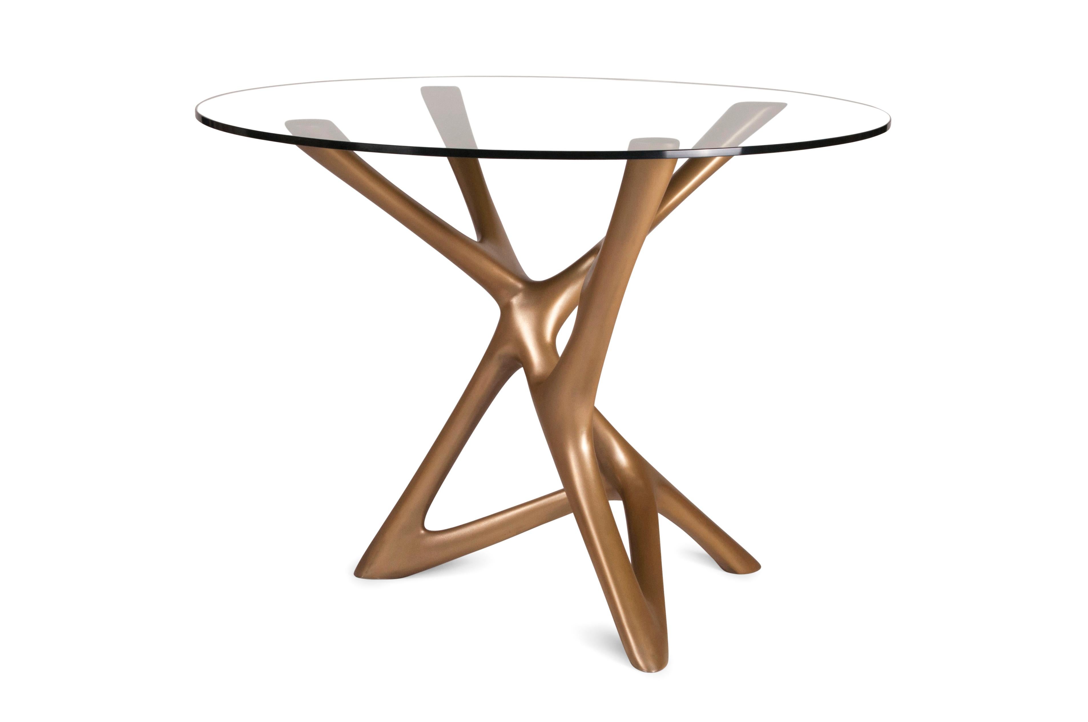 Ava center table is a unique sculptural table designed and manufactured by Amorph. The finish is our unique gold finish. The base dimension is 25