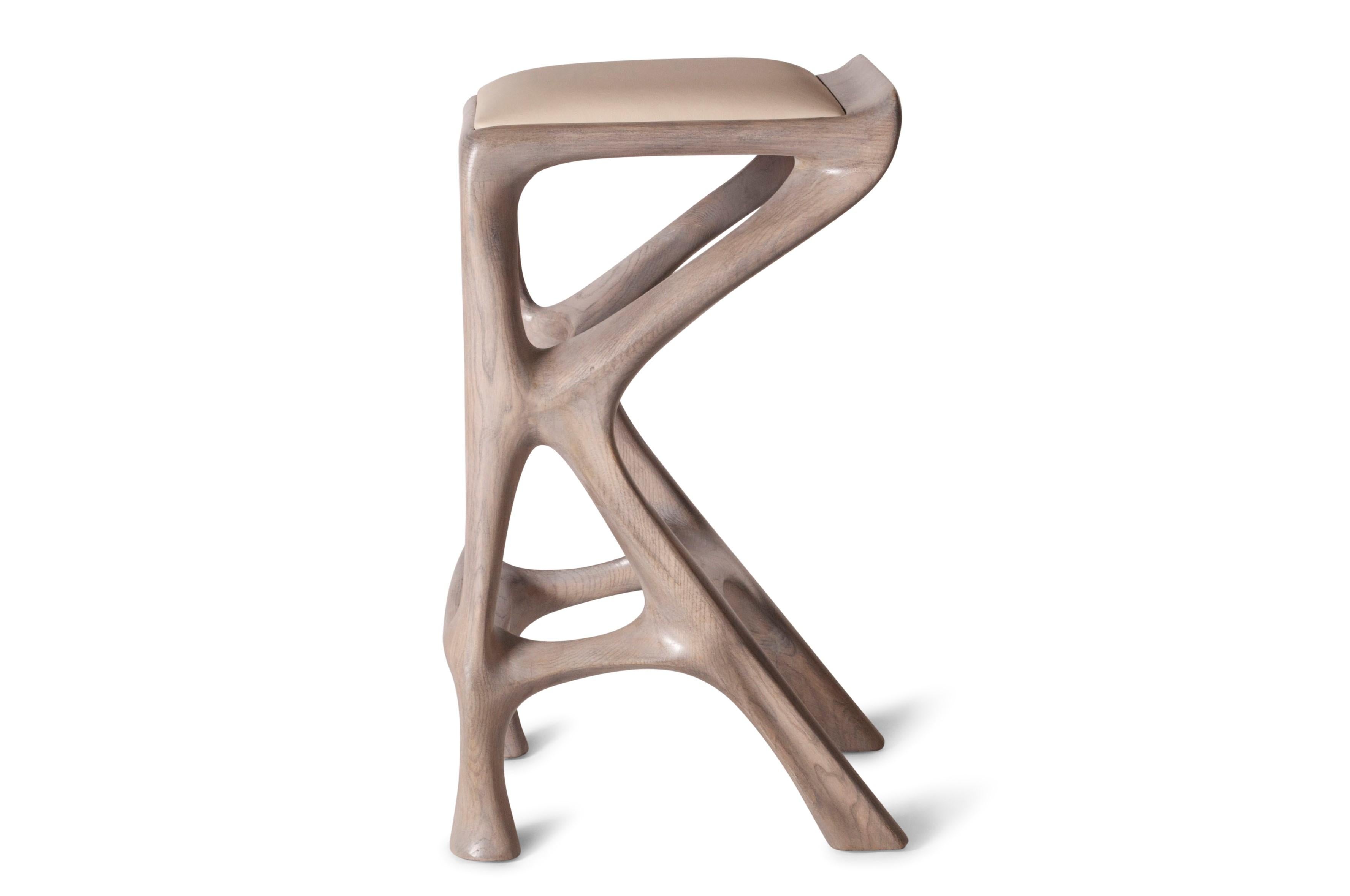 Barstool designed by Amorph made out of solid ashwood and leather. Stain color: Rusted walnut
Dimension 27