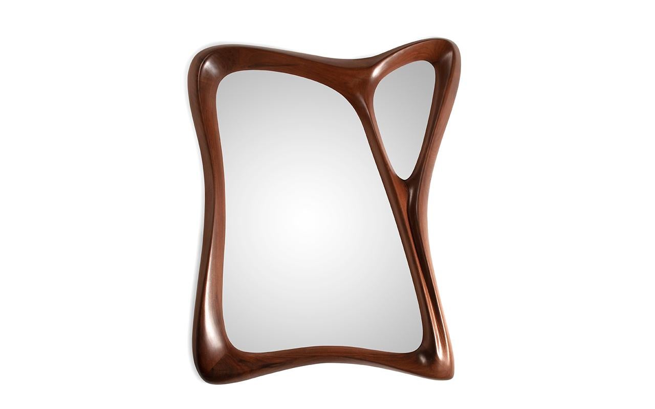 Jolie mirror is made out of solid Walnut wood with unique form. 
jolie mirror mounts with French clip. 

Jolie mirror available in different finishes and custom sizes. 

Amorph is a design and manufacturing company based in Los Angeles, California.