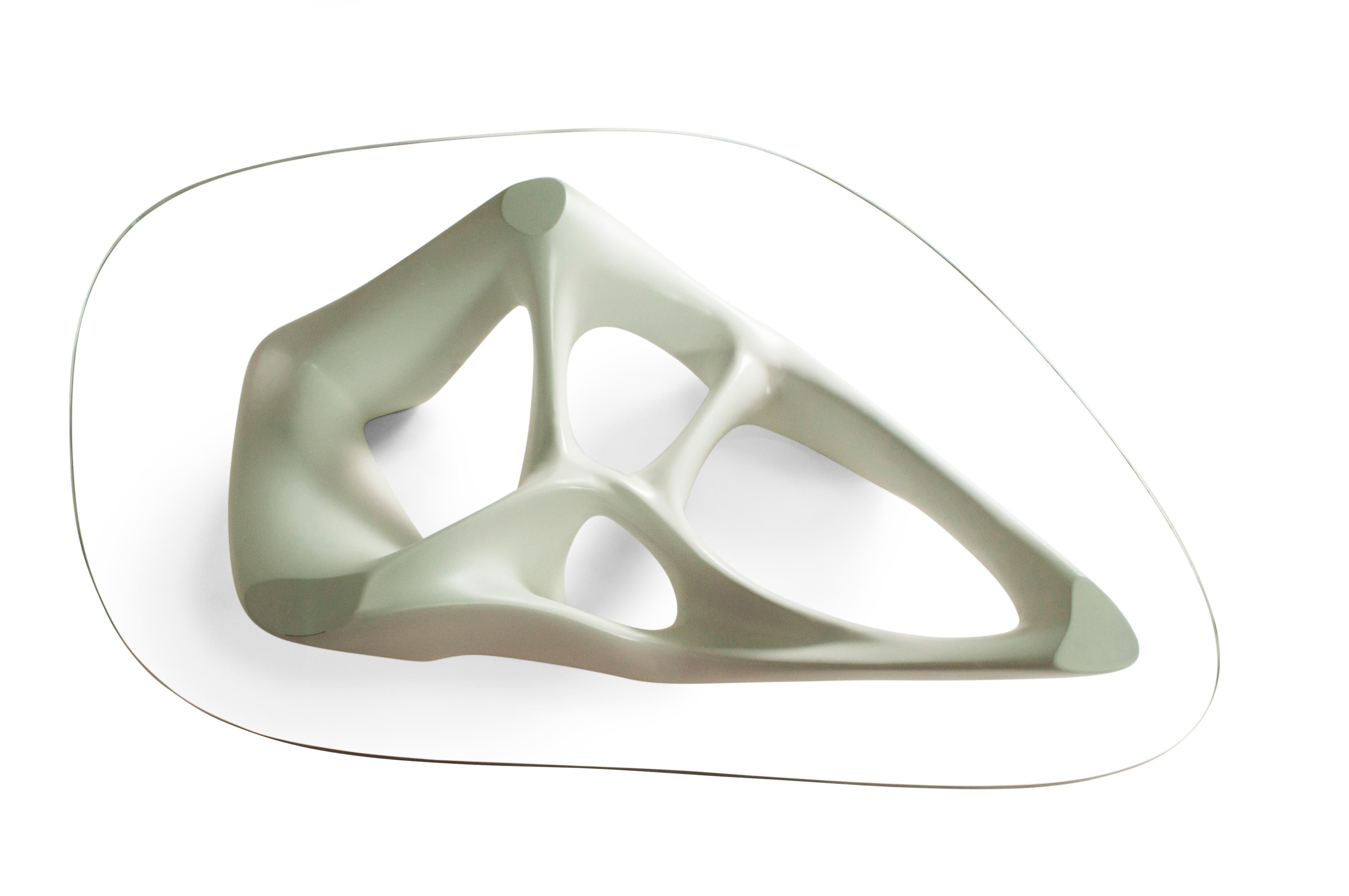 Net coffee table is a futuristic sculptural art table with a dynamic form designed and manufactured by Amorph. Net could be fitted in modern homes or offices or any spaces featuring as a contemporary style piece. Net is made out of a MDF matte white