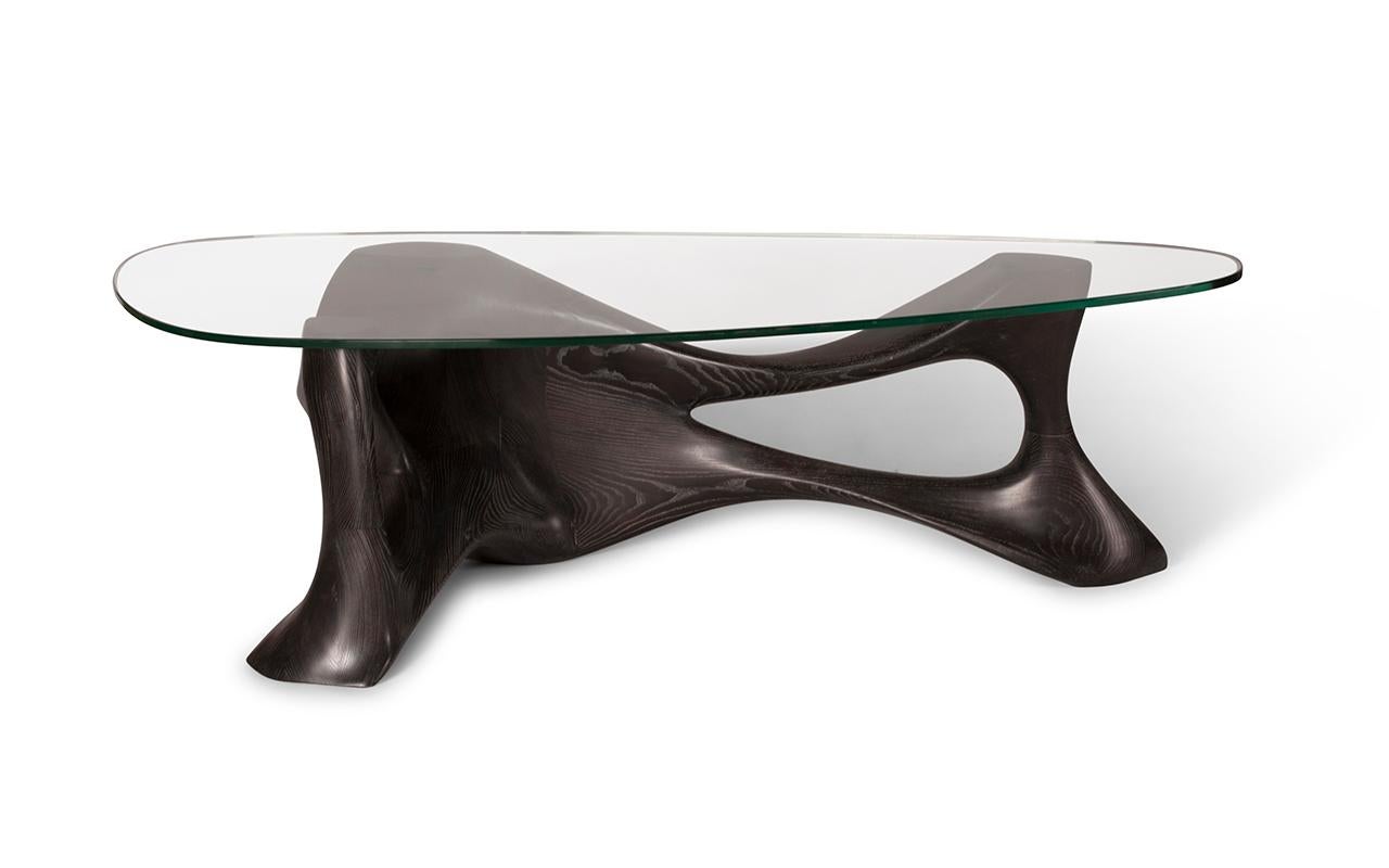 Nyx coffee table is made out of Ash wood with tempered glass top. 

About Amorph: 
Amorph is a design and manufacturing company based in Los Angeles, California. We take pride in hand crafted designs connected to technology to create sophisticated,