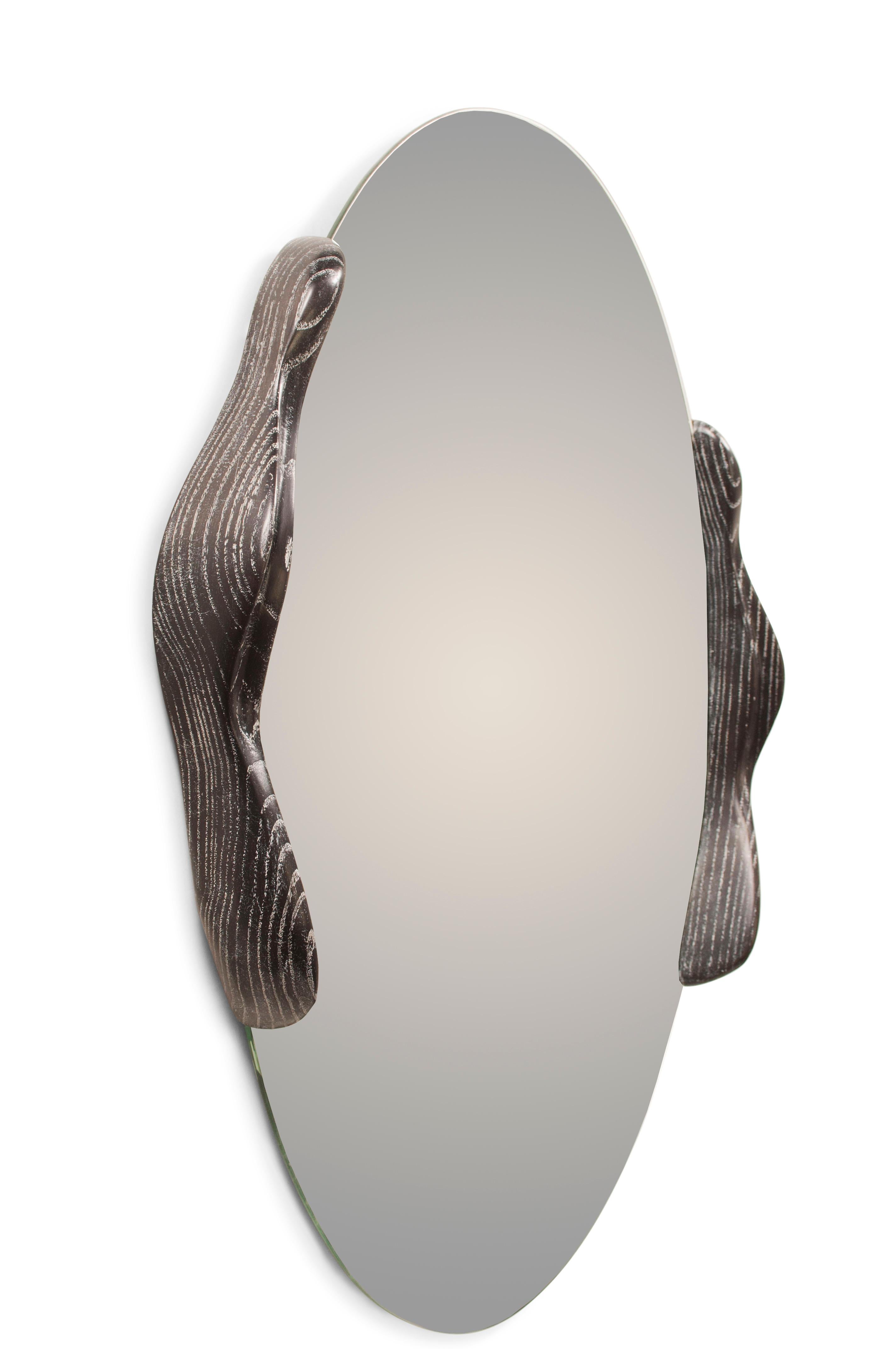 Oval shaped mirror with ash wood stained desert night, designed and manufactured by Amorph.
Mirror thickness 1/4