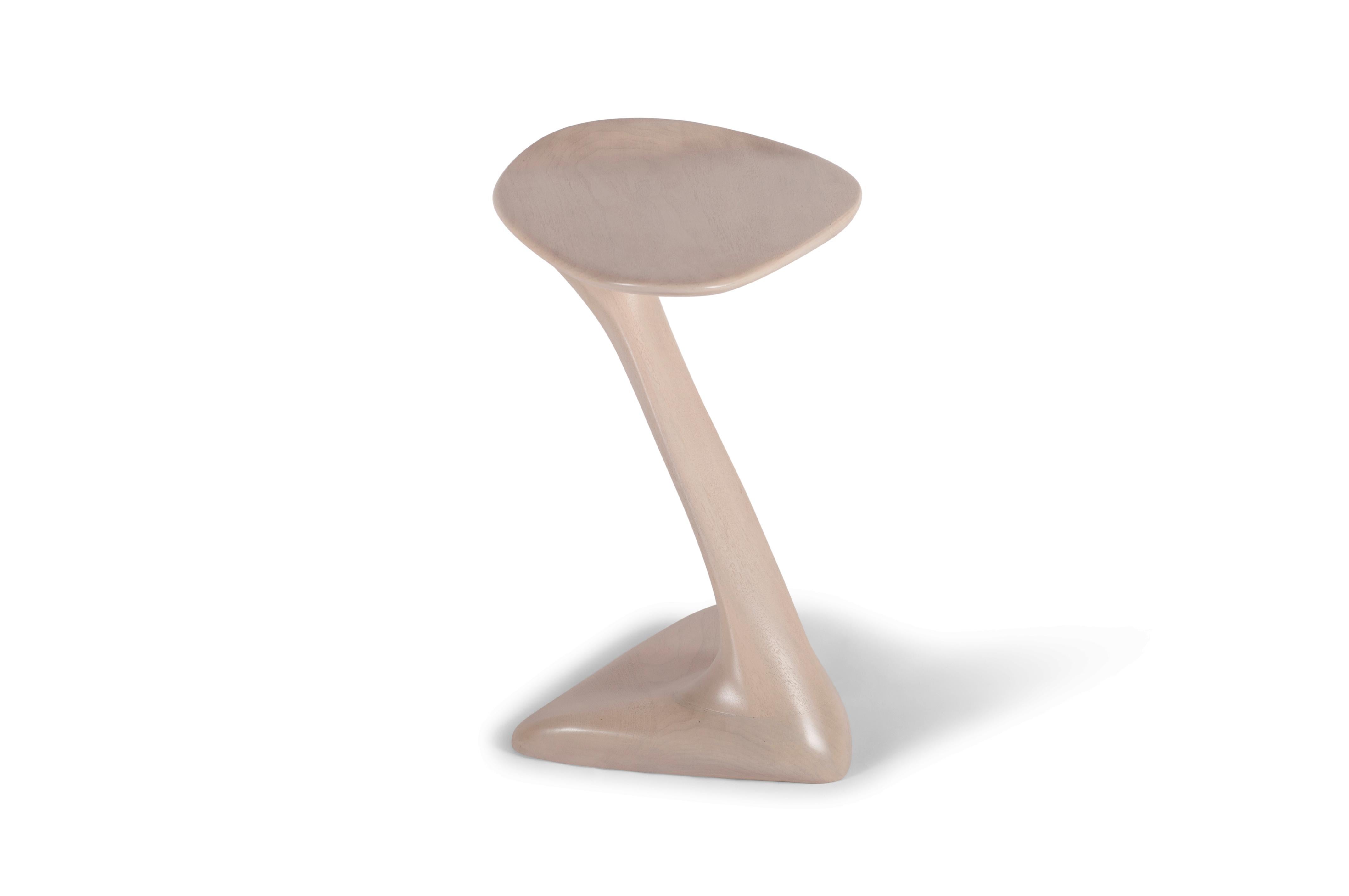 sculptural side table with unique and dynamic shaped designed and manufactured by Amorph. 
Snow stain on Walnut wood
Dimension: 19.25