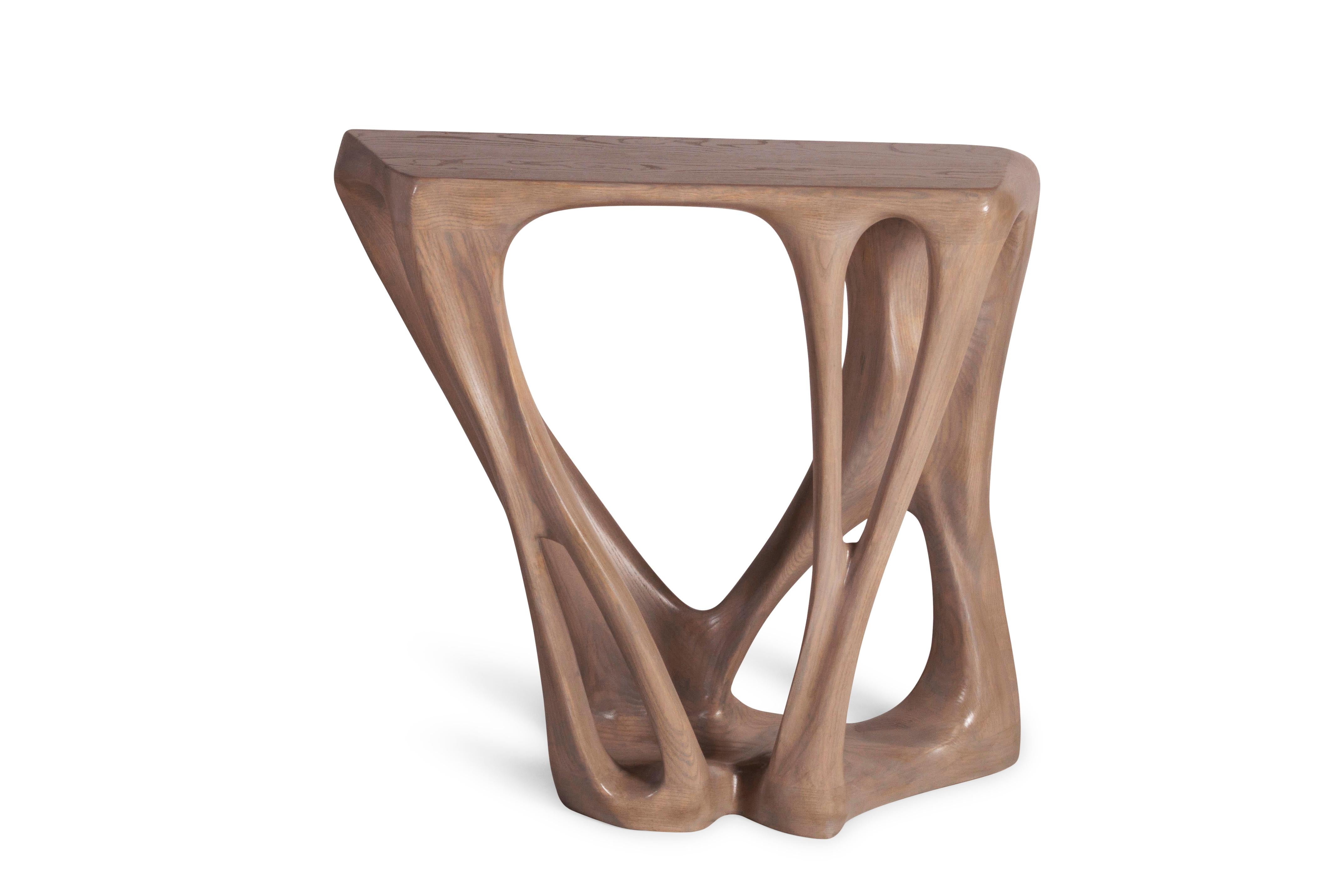 Petra console table is a unique organic shape console carved from solid ash wood. it is finished with gray oak stained. Available in custom sizes and finishes.

About Amorph: 
Amorph is a design and manufacturing company based in Los Angeles,