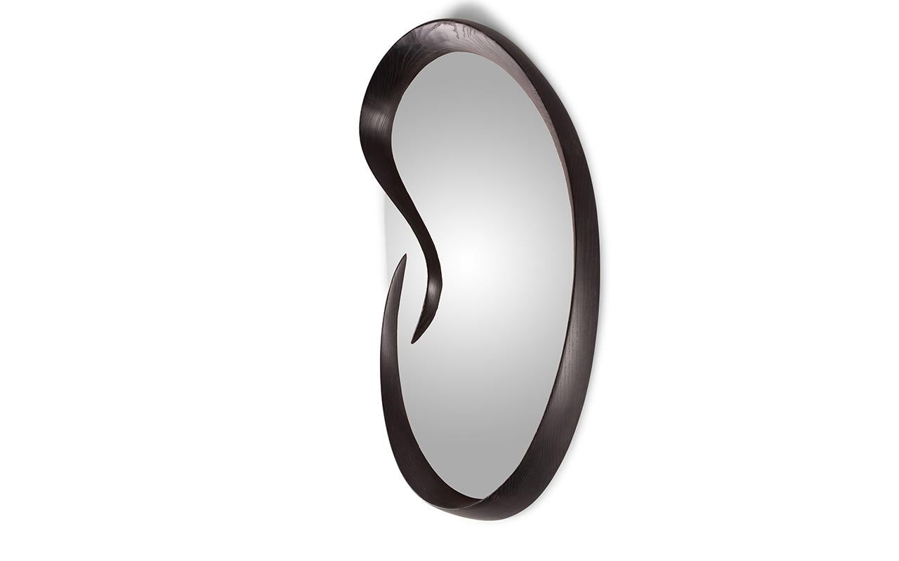 Swan mirror is wall mounted and comes with Z clip bracket. 
it is available in different sizes and finishes. 

About Amorph: Amorph is a design and manufacturing company based in Los Angeles, California. We take pride in handcrafted designs