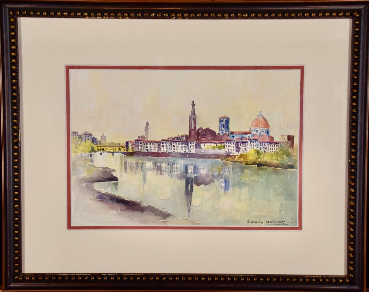 Voici une belle aquarelle colorée de Florence, en Italie, intitulée "Firenze 2009" par Amos Deklin. Elle est signée par l'artiste en bas à droite. La scène représente la ville de Florence vue depuis la rive opposée de l'Arno, vraisemblablement