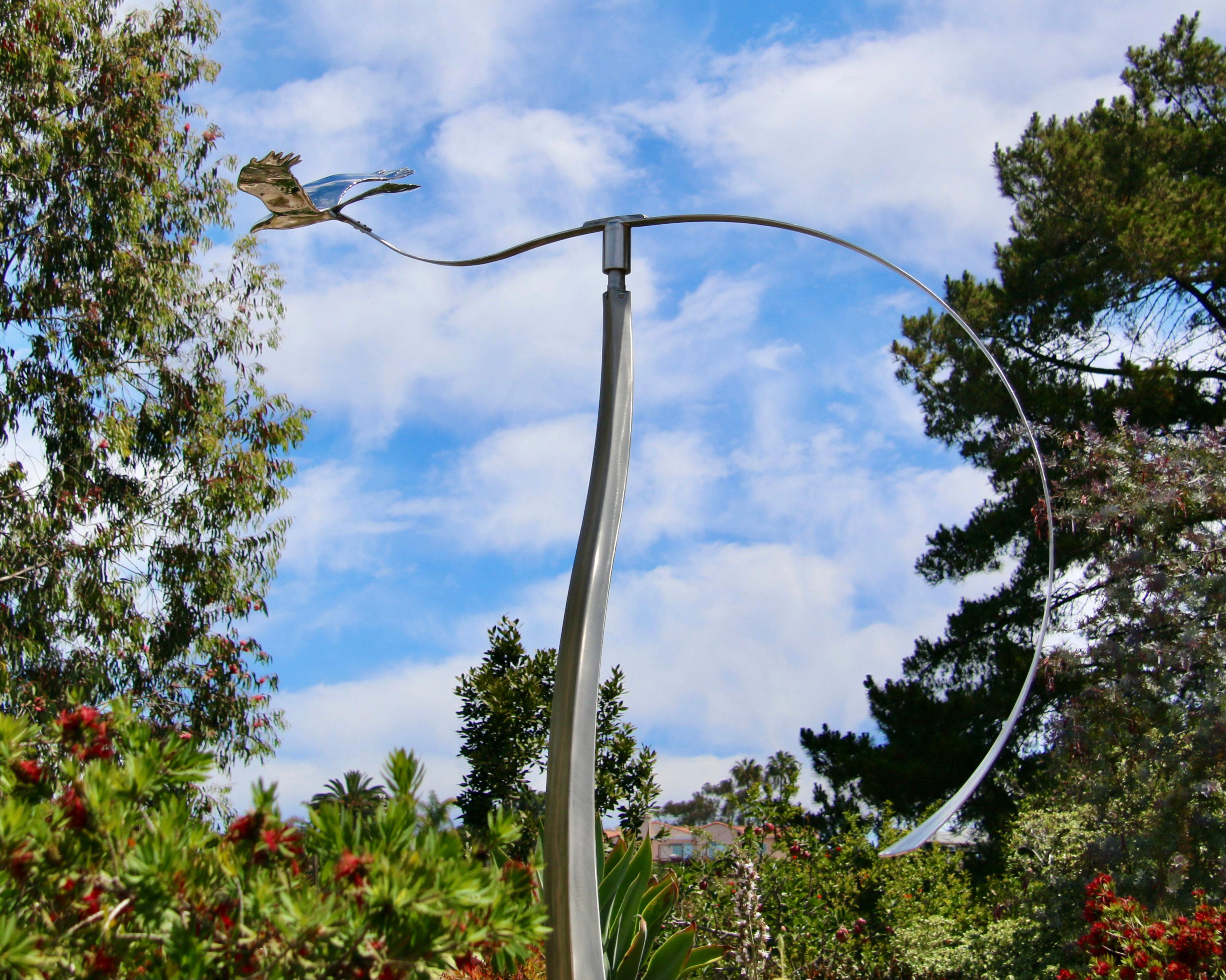 The majesty of an eagle as it soars through the air is captured in this stunning contemporary sculpture by Amos Robinson. The American artist has been recognized internationally for his elegant kinetic metal sculptures that are often designed to