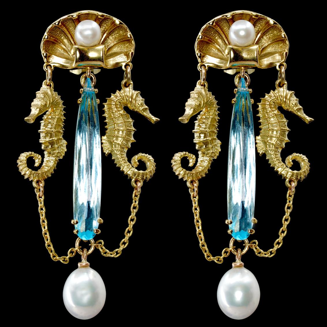 Fit for a goddess, the Amphitrite's Tears Earrings are truly a sight to behold.

Beautifully handcrafted in 18kt yellow gold, each earring features a stunning 6.3ct teardrop cut 5mm x 30mm Swiss blue Topaz and two creamy freshwater pearls. 
