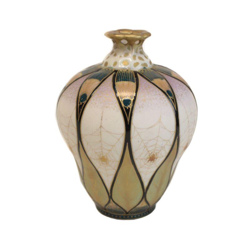 Amphora Austria Art Nouveau Hand Painted Porcelain Spider Vase, circa 1890

A stunning Amphora Austria Art Nouveau hand painted porcelain spider vase, circa 1890. Beautiful hand painted gilt spiderwebs with peacock feathers throughout. Reticulated