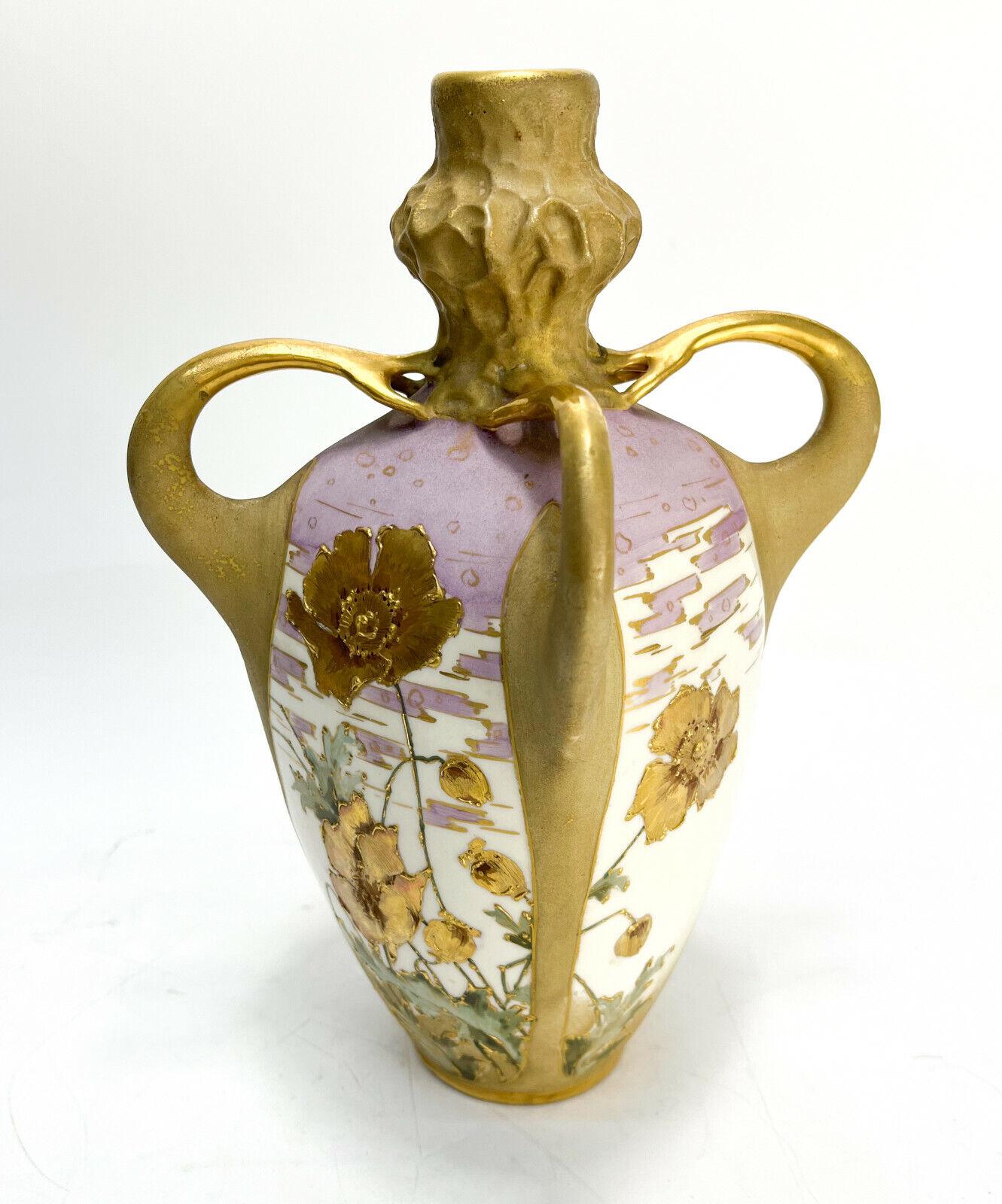 Amphora Austria Porcelain 4 Handled Art Nouveau Vase, circa 1890.

A peach and lavender ground with gold encrusted flowers throughout. Impressed Amphora mark to underside. 

Additional Information:
Country/Region of Manufacture: Austria