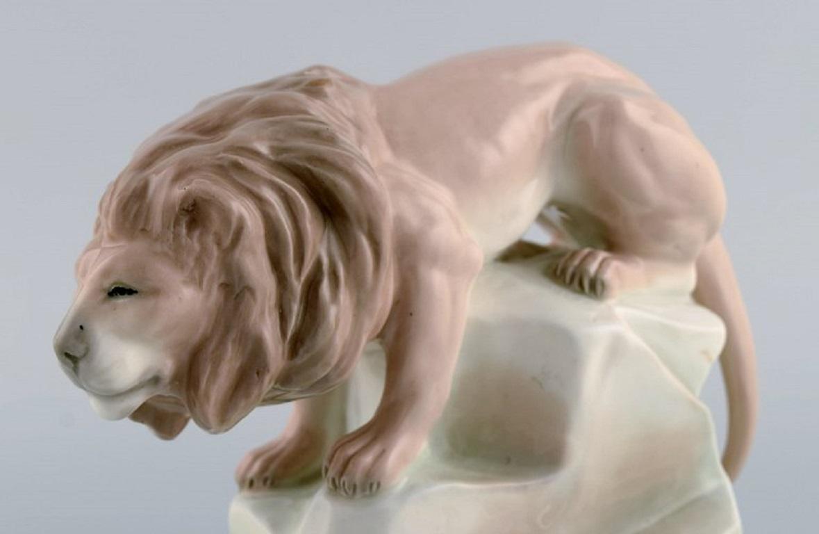 Mid-20th Century Amphora, Czechoslovakia, Hand-Painted Art Deco Porcelain Figurine of a Lion For Sale
