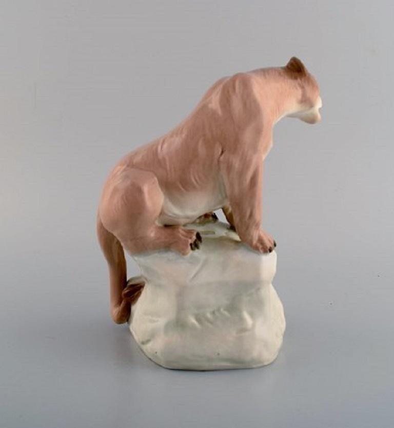 Art Deco Amphora, Czechoslovakia, Hand-Painted Porcelain Figurine of Lioness on Rock For Sale