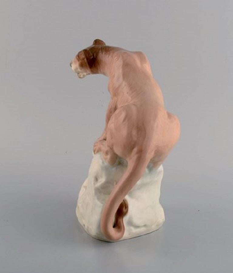 Amphora, Czechoslovakia, Hand-Painted Porcelain Figurine of Lioness on Rock In Excellent Condition For Sale In Copenhagen, DK