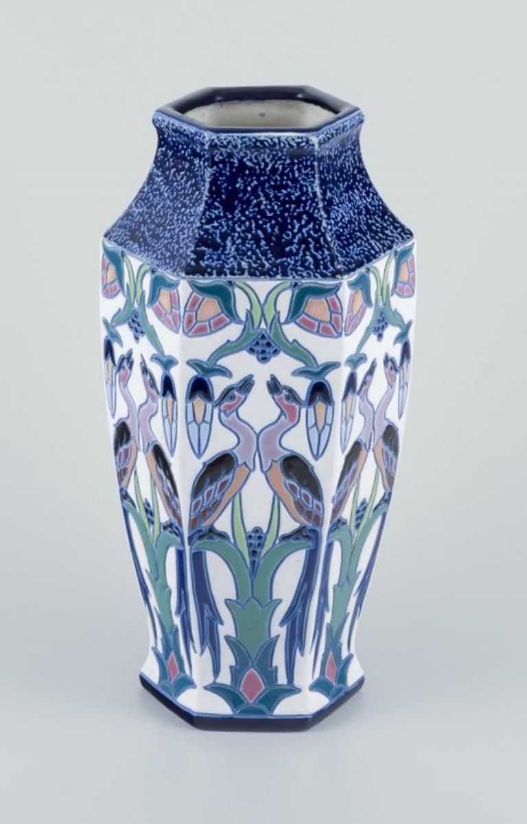 Amphora, Czechoslovakia.
Large and impressive Art Deco vase in faience.
Motif of exotic birds.
Hexagonal shape.
Hand painted.
Circa 1930s.
Model number 15407
Marked.
Perfect condition.
Dimensions: H 34.5 cm. x D 16.0 cm.
