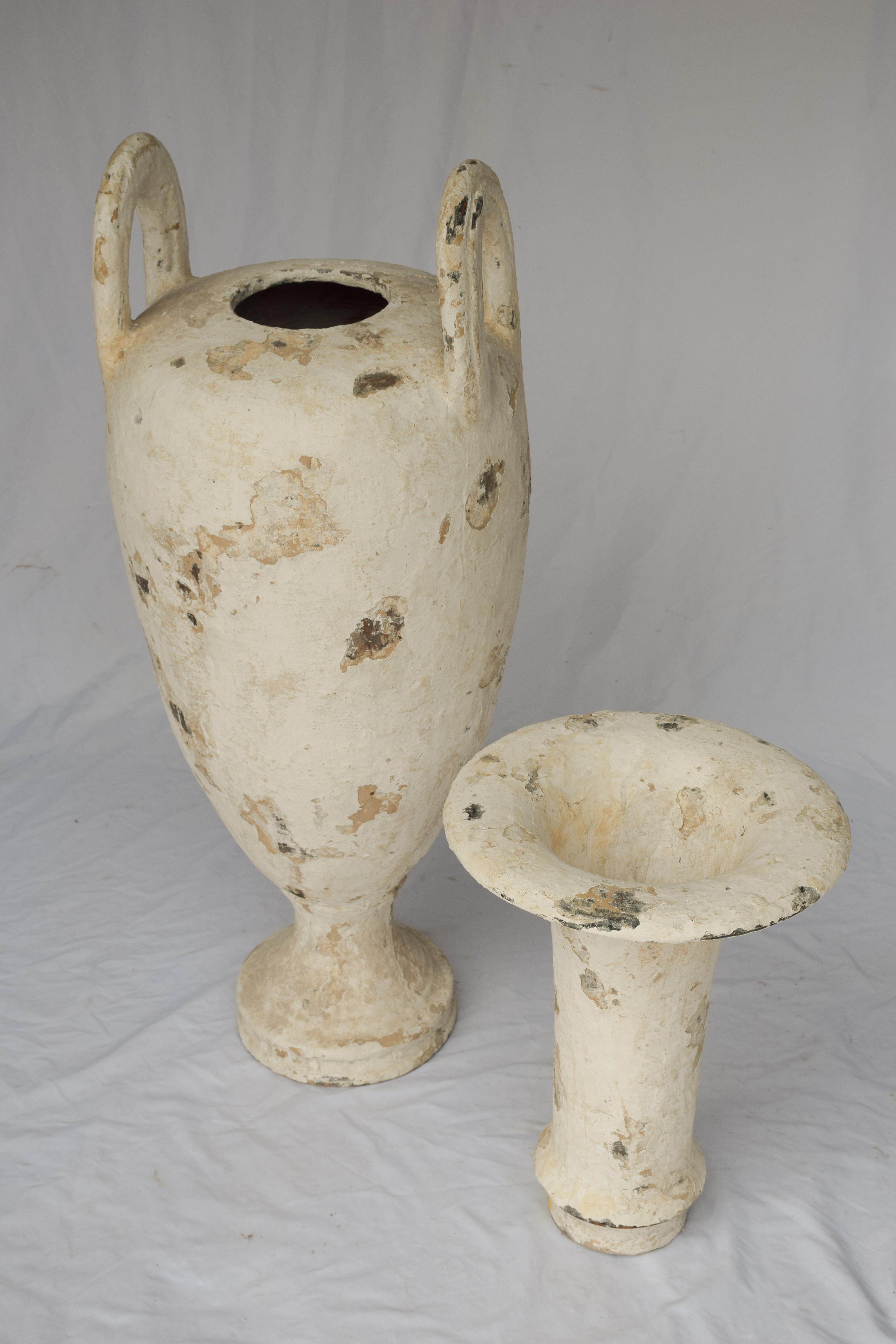 Often referred to as an olive oil jar, but are actually an amphora, which is a type of container of a specific shape and dimension, beginning in the Neolithic Period, which ran from approximately 9000BC to 3500BC. Generally, Amphora jars were used