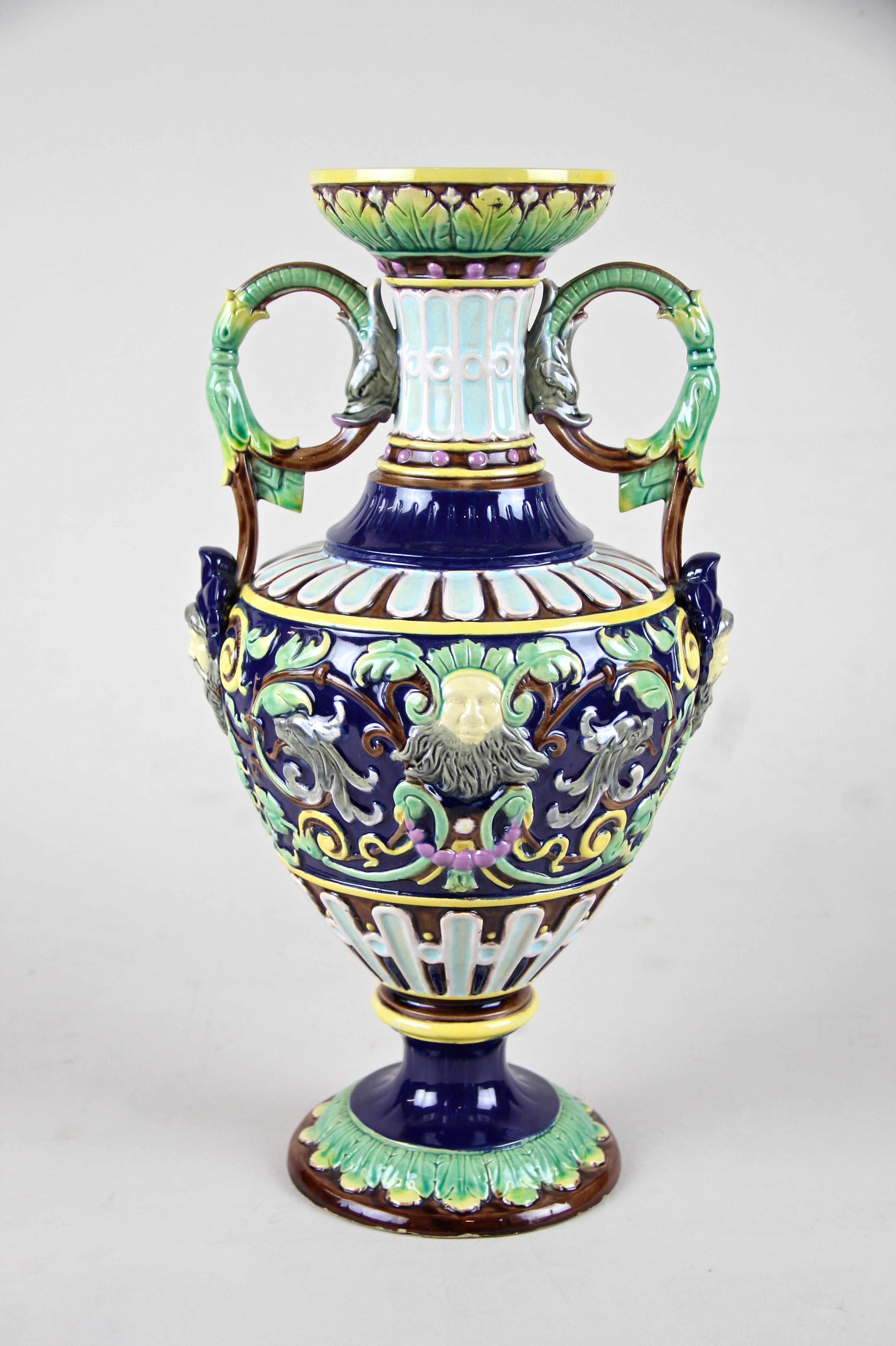 From around 1880 out of Bohemia, now the Czech Republic, comes this lovely colorful Amphora Majolica Vase from the famous company of Wilhelm Schiller & Son. A gorgeous bulbous shape, wonderfully colored in dark blue, brown and green tones gives this