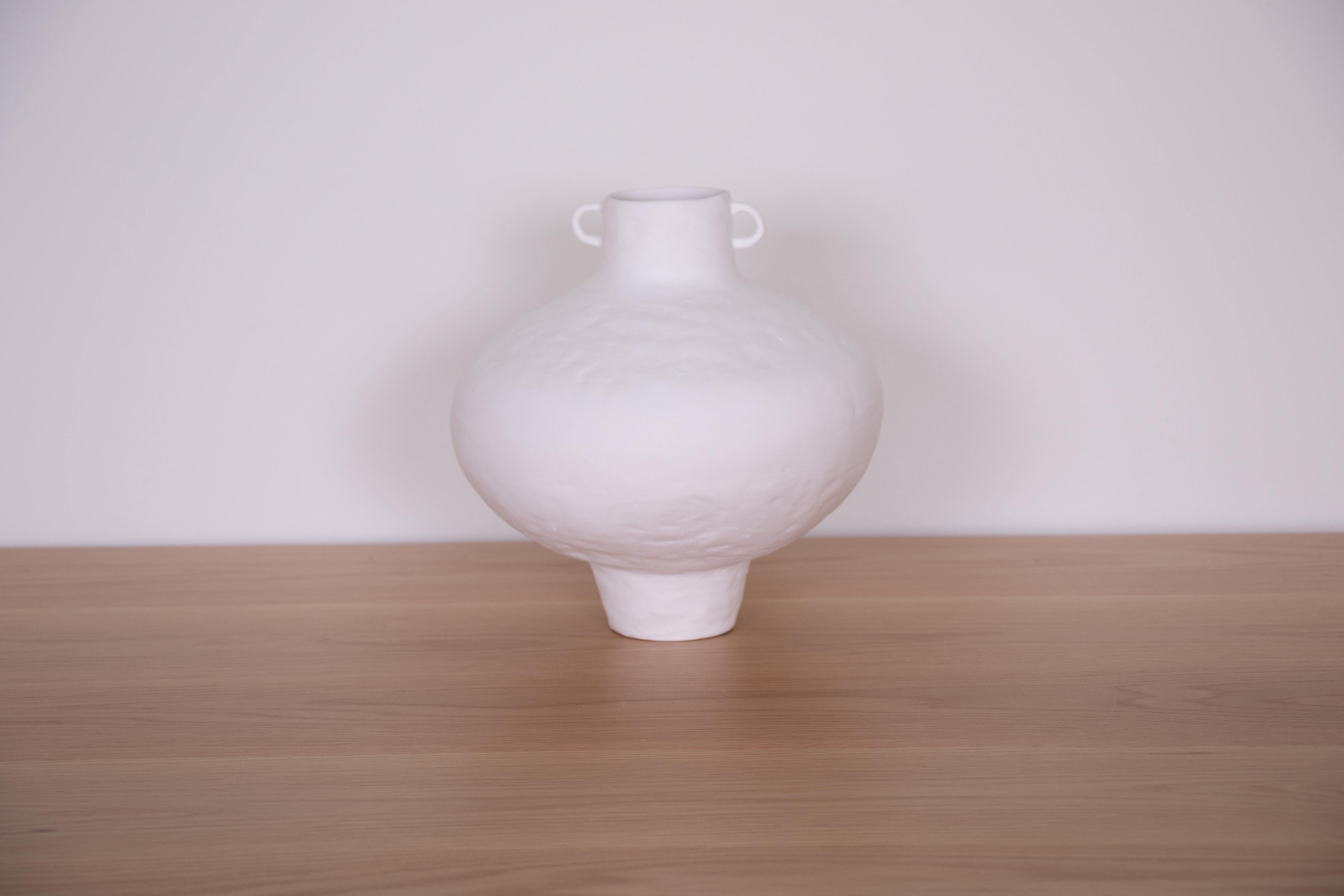 Hand-built terracotta vase in an amphora shape and painted white. Newly made in Spain.