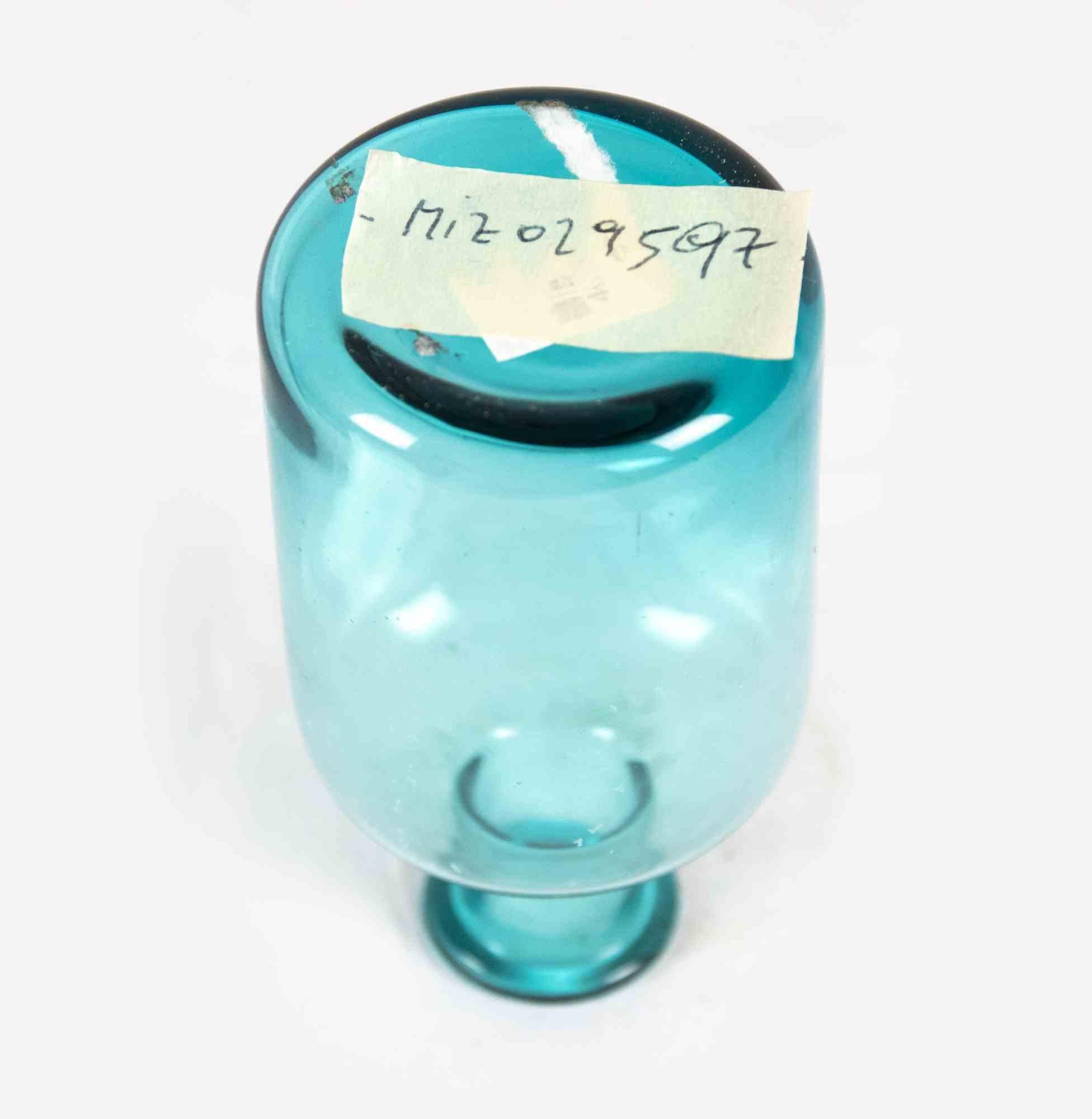 Ampoule for perfumes is an original decorative object realized in Italy in the 1970s.

Original turquoise Art Glass. 

Made in Italy.

Dimensions: 22 x 6 cm. 

Good Conditions.
 