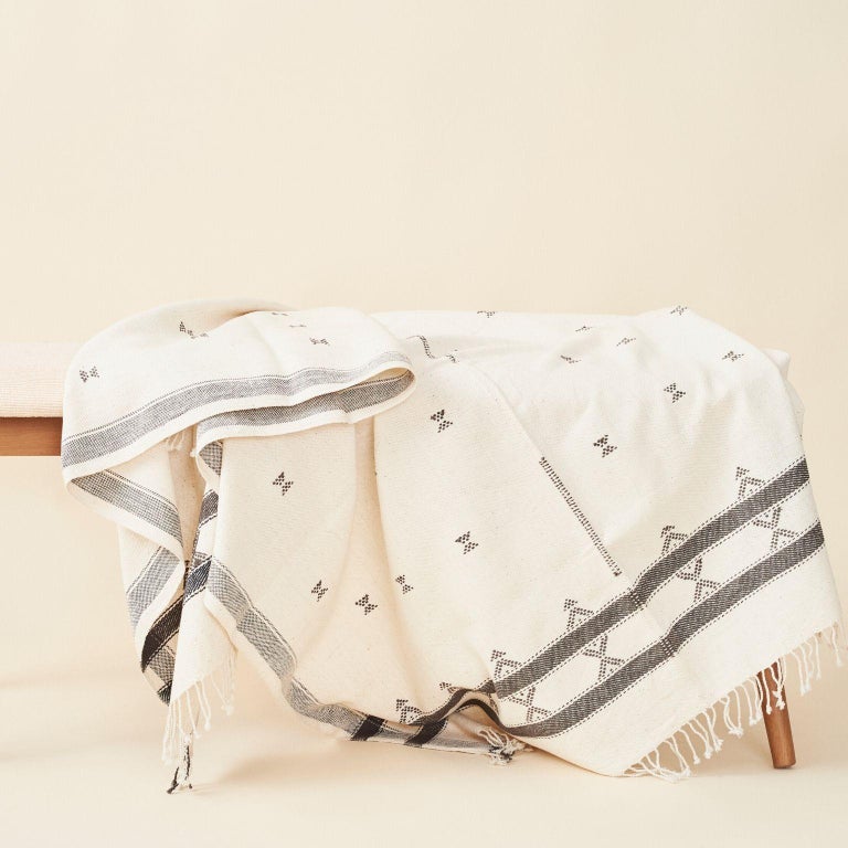 Custom design by Studio Variously, AMRO throw / bedspread / blanket is handwoven by master weavers in India and dyed entirely with earth-friendly dyes developed locally to artisan cluster. 

A sustainable design brand based out of Michigan, Studio