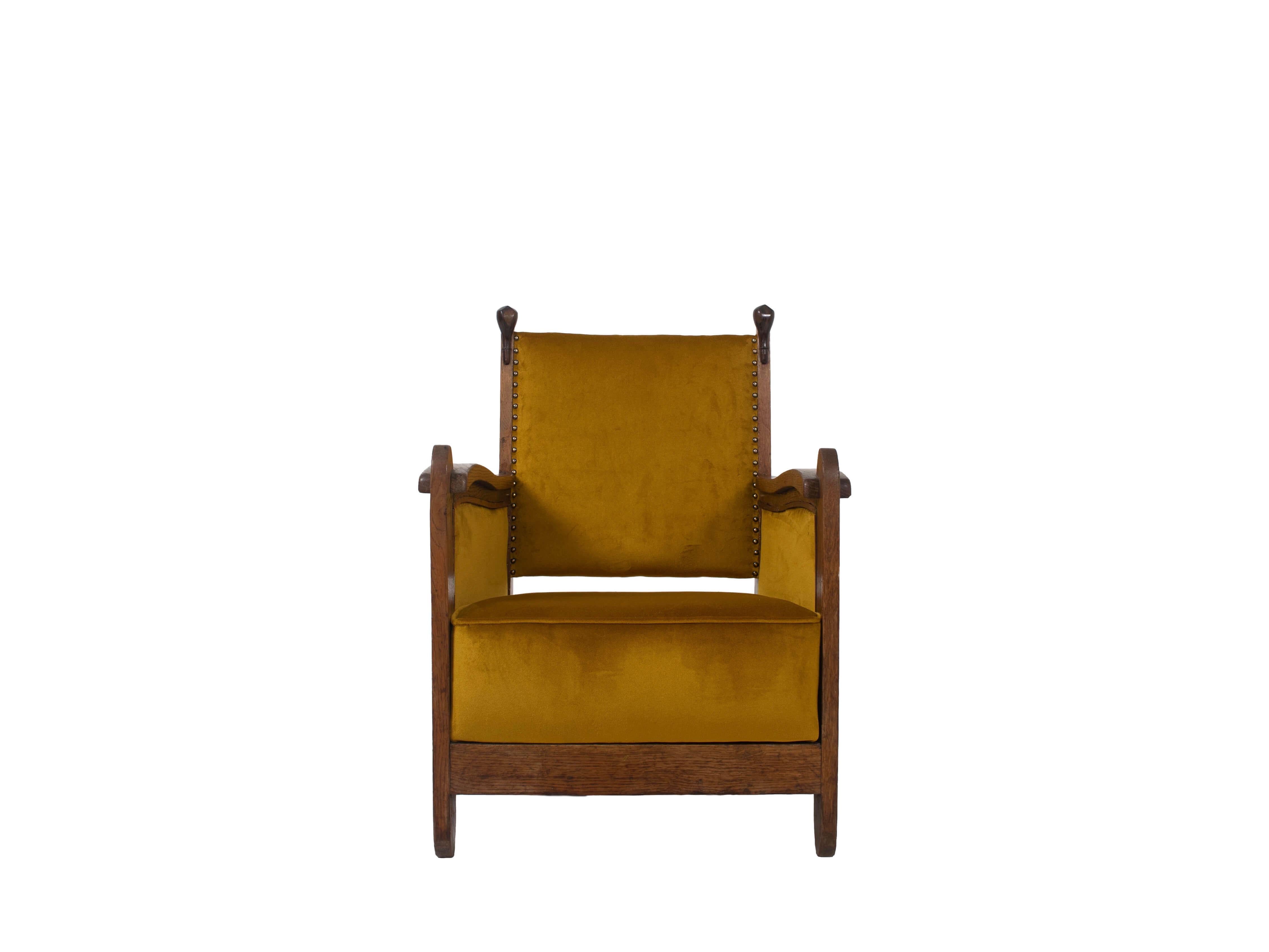 Truly amazing Amsterdam School armchair from The Netherlands around the 1930s. This chair is newly upholstered in a Gold Yellow Fabric that colors beautifully with the Oak and Coromandel wood. The eye-catcher of this chair is the two wooden 'bulbs'