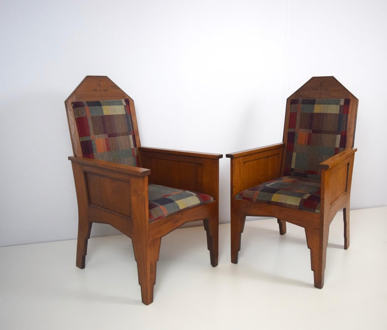 Beautiful Art Deco armchairs from Indonesia (during that time called: Dutch East Indies) in Amsterdam School Style, manufactured in the 1920s. The chairs are fully restored and have new upholstery in a beautiful fabric. The back of the chairs can be
