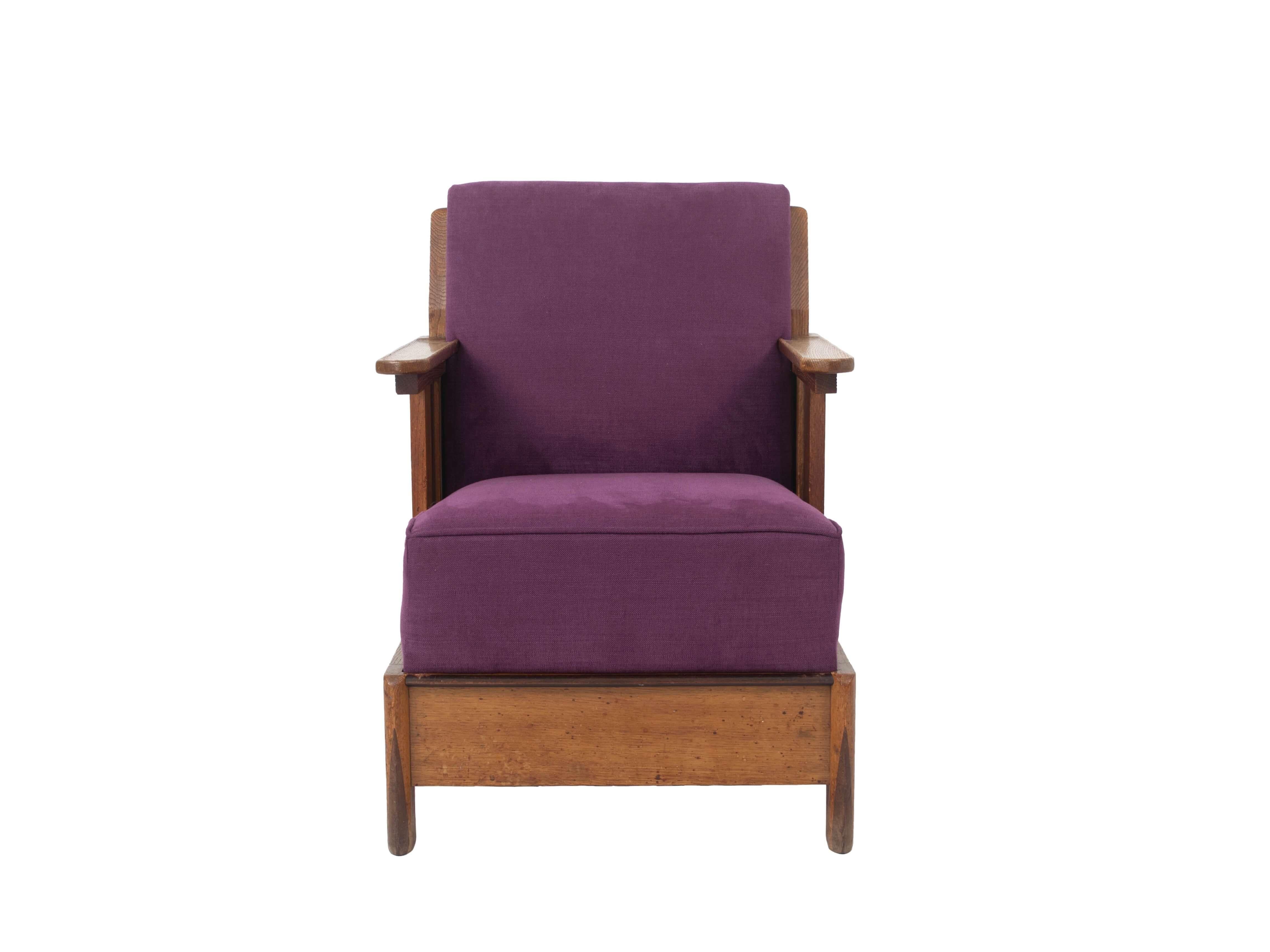 Very nice Amsterdam School armchair in newly upholstered purple fabric from The Netherlands 1930s. This chair was bought from the first owner, where it has always been in the family. It has a great minimalistic design with nice details on the feet