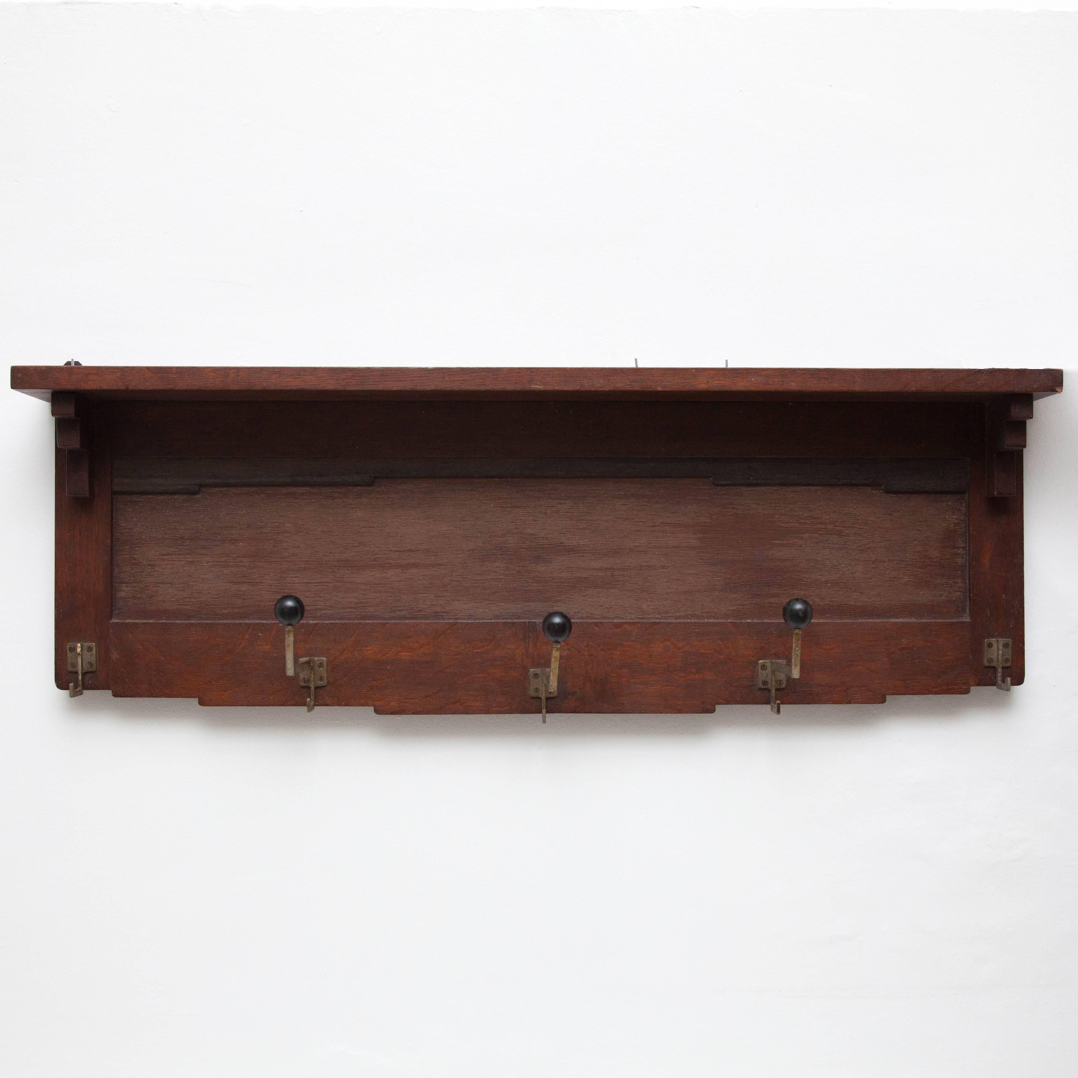 Add a touch of vintage charm and functionality to your entryway with this Amsterdam School style coat rack. Crafted circa 1940 and manufactured in Holland, this piece showcases the rationalist design principles prominent during that era.

Made of