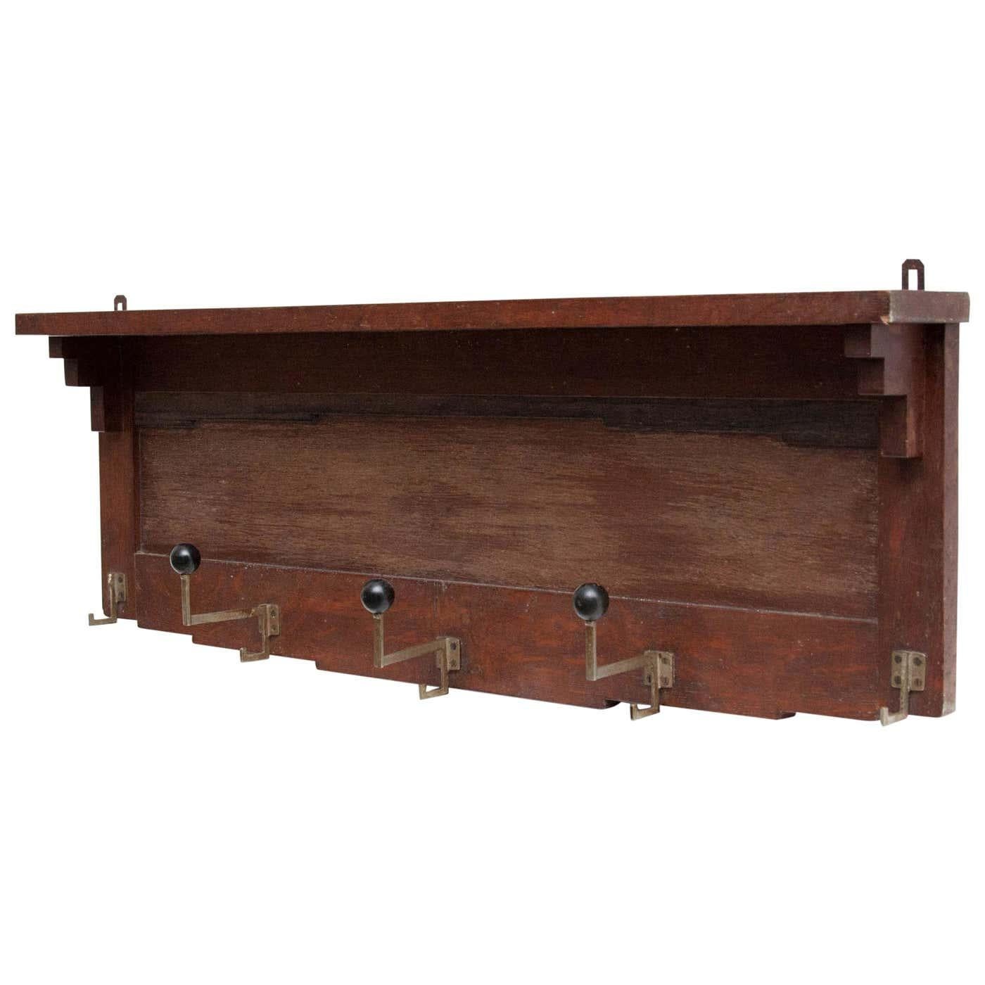 Add a touch of vintage charm and functionality to your entryway with this Amsterdam School style coat rack. Crafted circa 1940 and manufactured in Holland, this piece showcases the rationalist design principles prominent during that era.

Made of